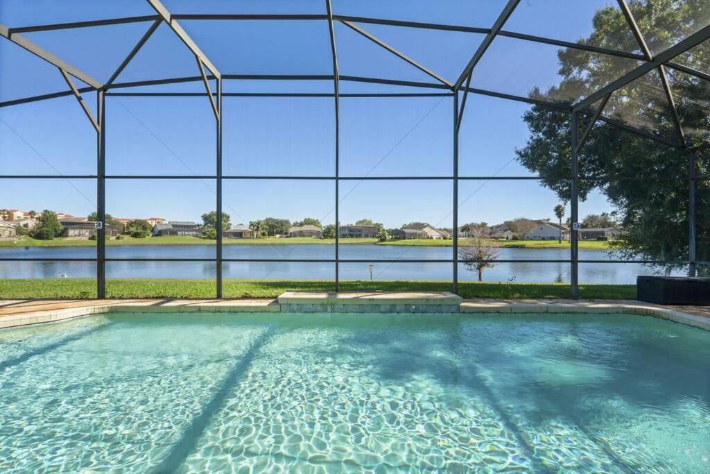 BRAND NEW! Lakefront 9BR Pool Hot Tub Outdoor Kitchen BBQ Theater 2 miles Disney
