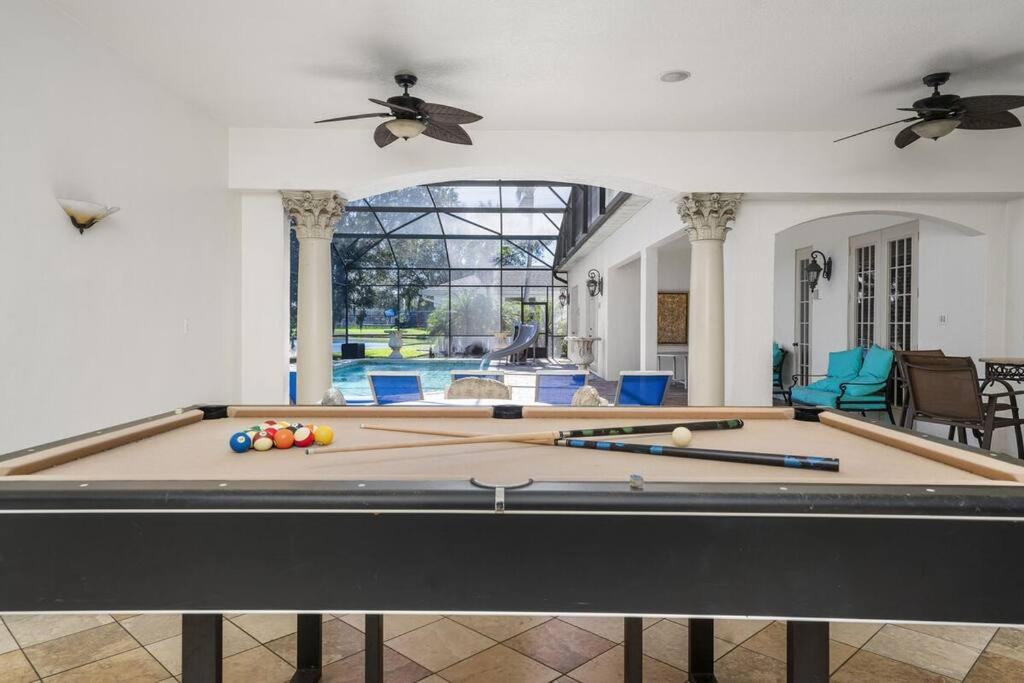 BRAND NEW! Lakefront 9BR Pool Hot Tub Outdoor Kitchen BBQ Theater 2 miles Disney