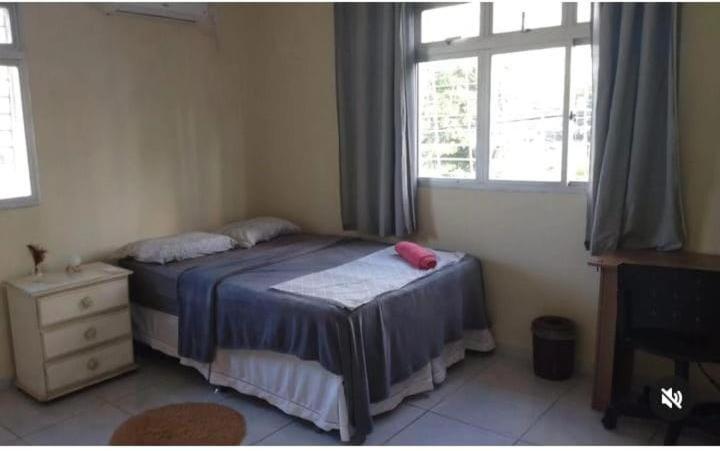 Quartos em apartamento rústico e aconchegante