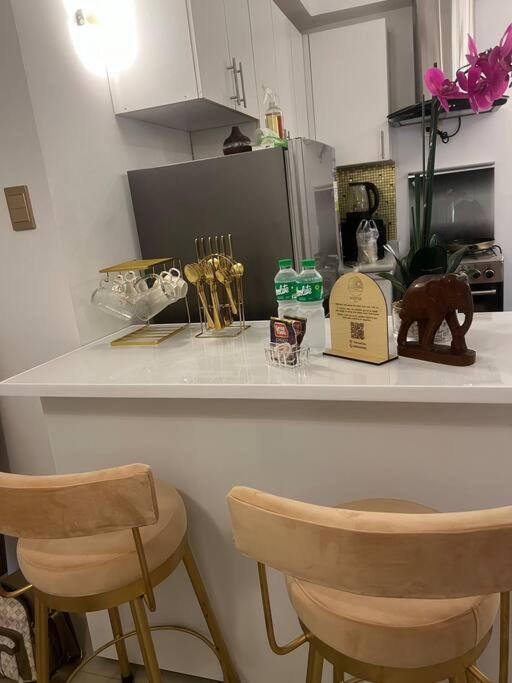 Condo Near Airport Okada MOA w/ 60 inch smart TV view 4