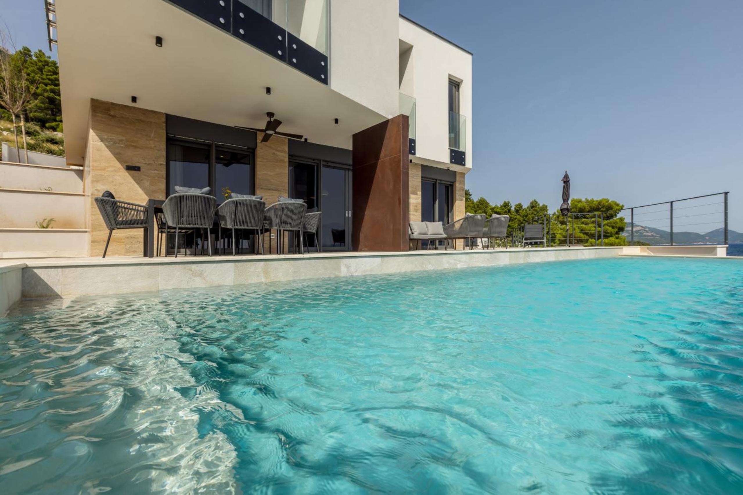 Beachfront Luxury Villa Mare, featuring a heated pool, fitness area, and sauna view 3