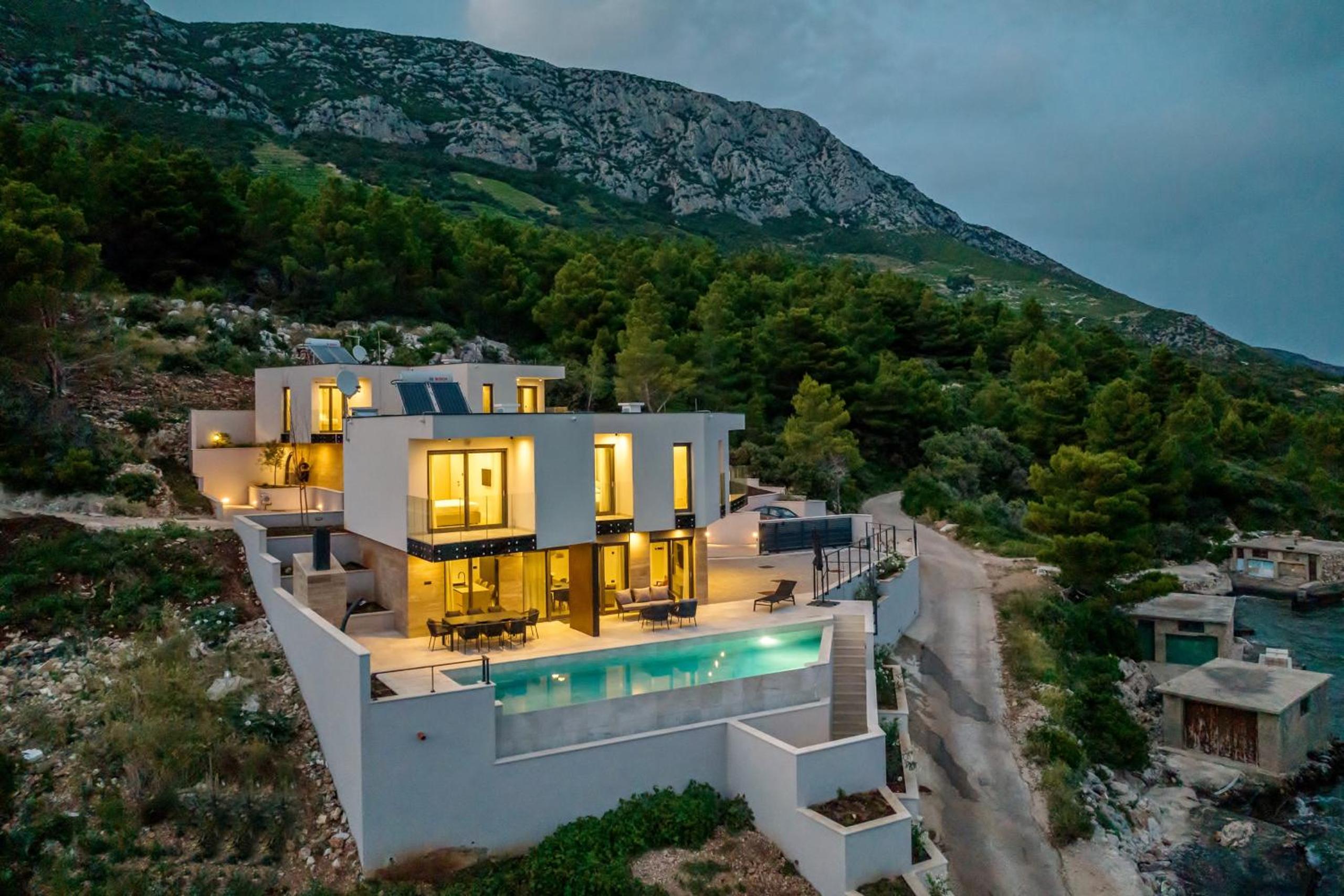 Beachfront Luxury Villa Mare, featuring a heated pool, fitness area, and sauna view 4