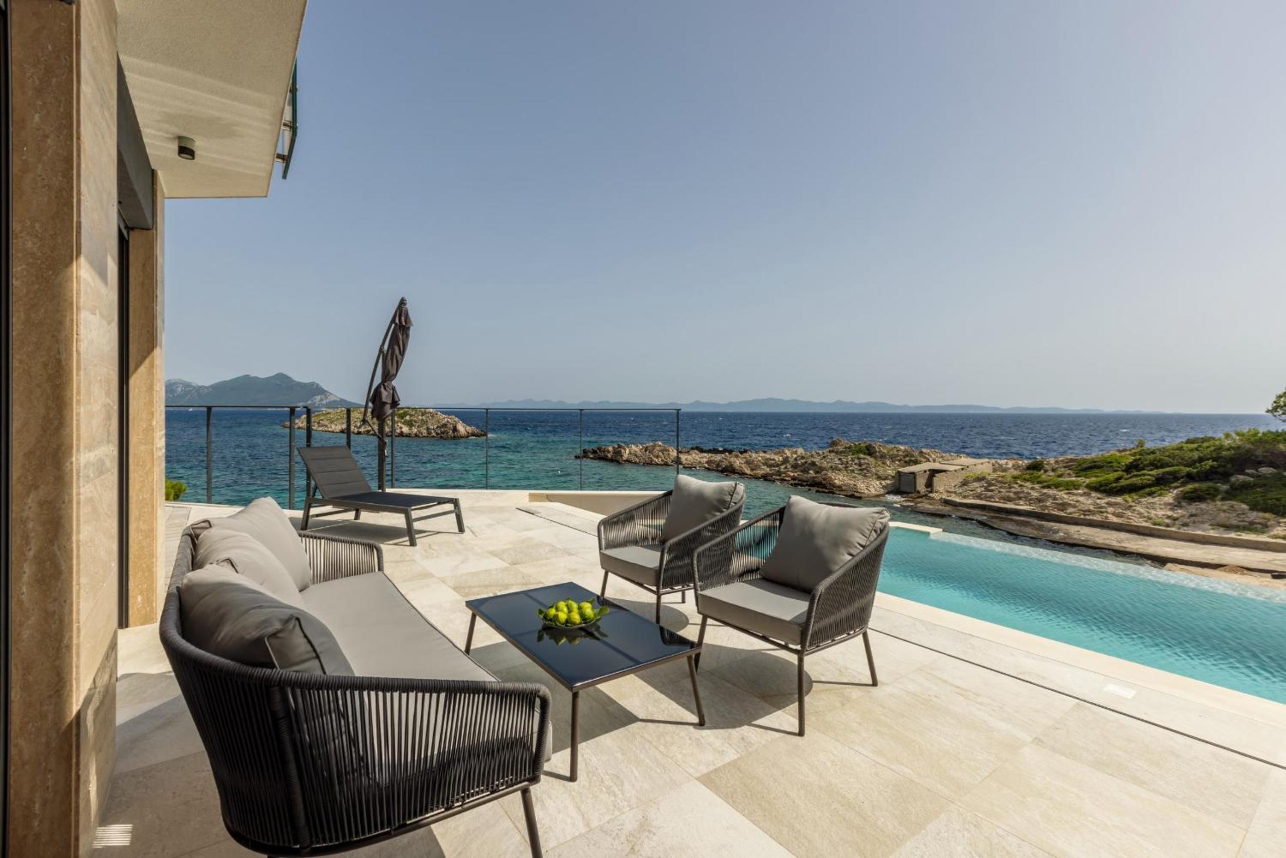 Beachfront Luxury Villa Mare, featuring a heated pool, fitness area, and sauna view 5