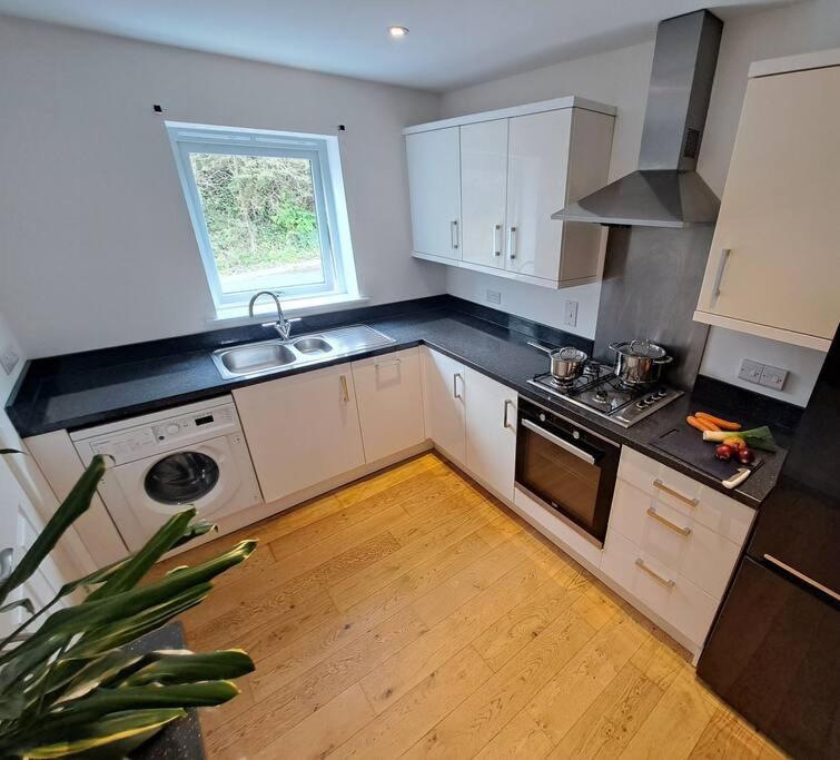 Vibrant Coastal Village Retreat- private parking view 3