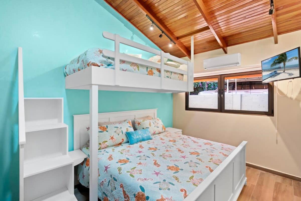 Stylish 2-Bedroom Beach Condo with Ocean-View Deck, Lush Pool Area & 2-Minute Walk to Flamingo Beach