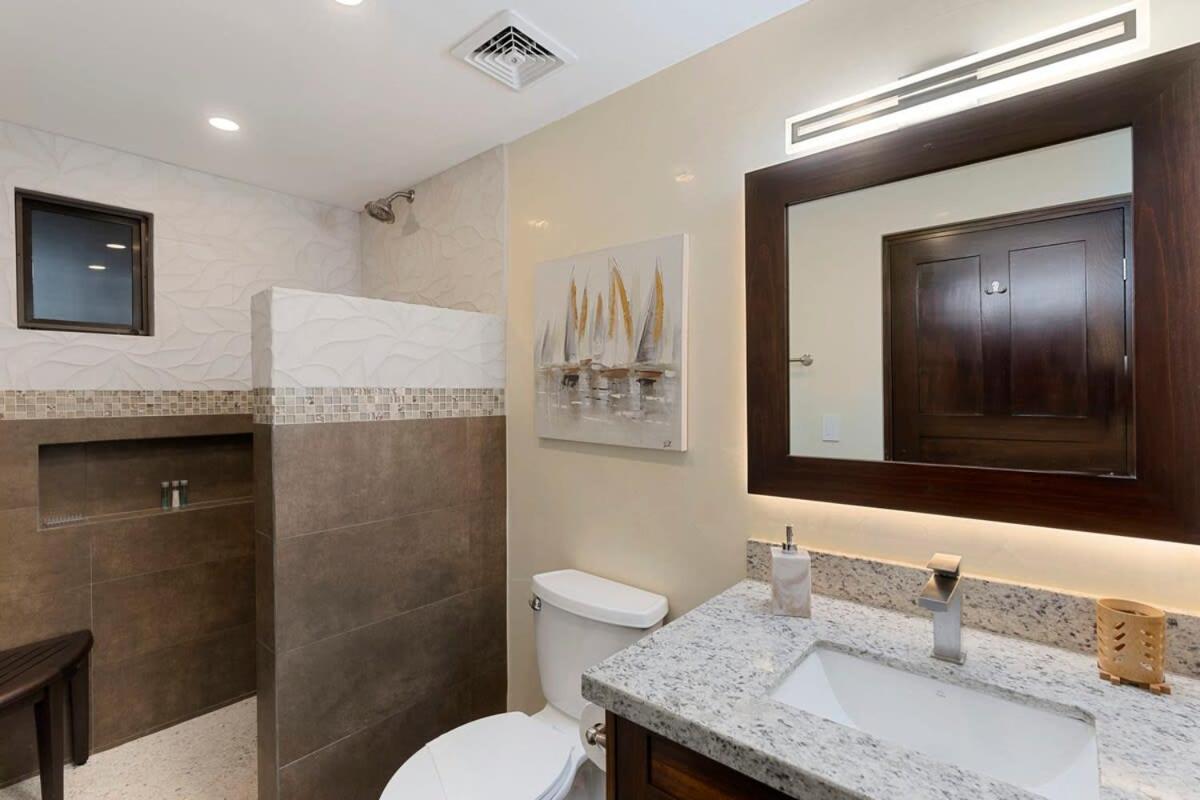 Stylish 2-Bedroom Beach Condo with Ocean-View Deck, Lush Pool Area & 2-Minute Walk to Flamingo Beach