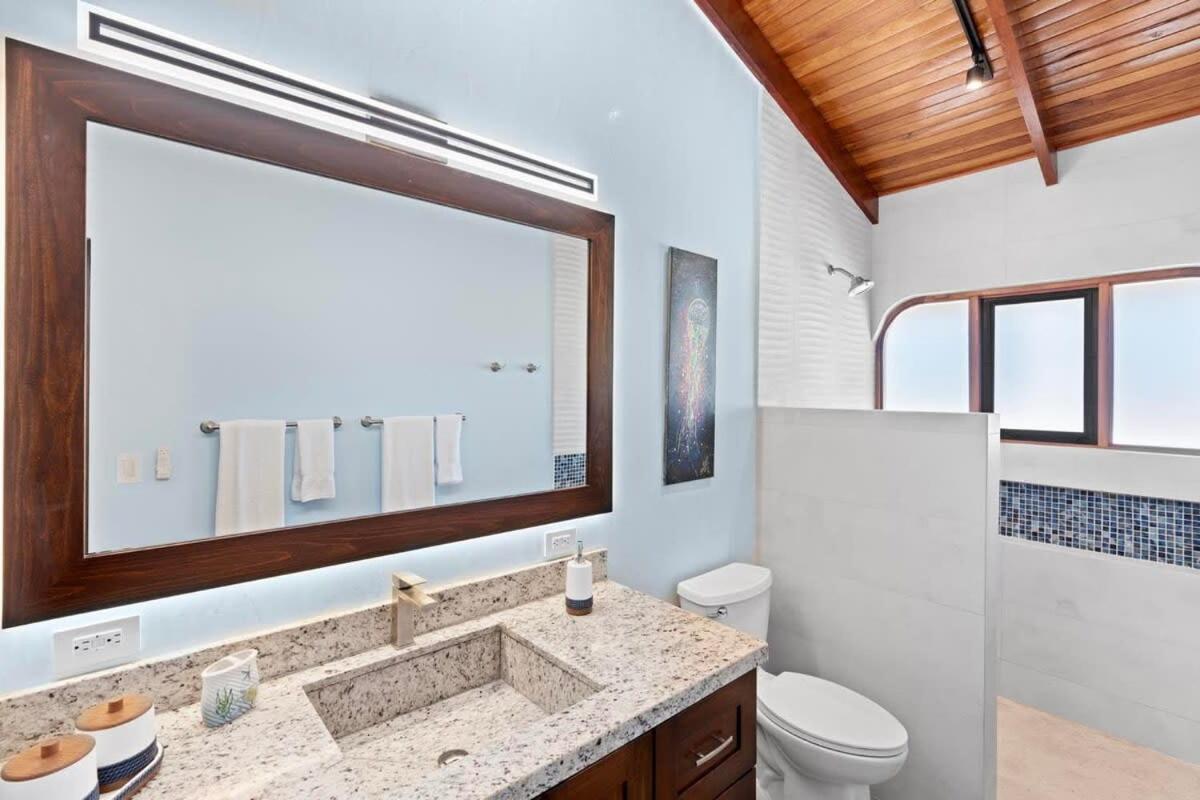 Stylish 2-Bedroom Beach Condo with Ocean-View Deck, Lush Pool Area & 2-Minute Walk to Flamingo Beach