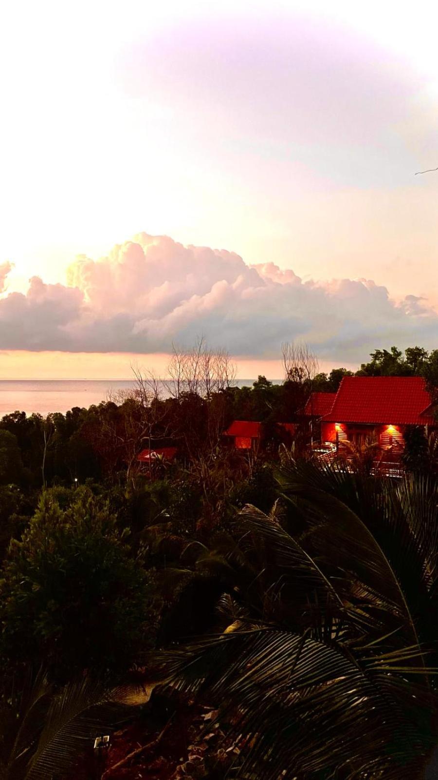 Amazing sunrise over wooden house at the East