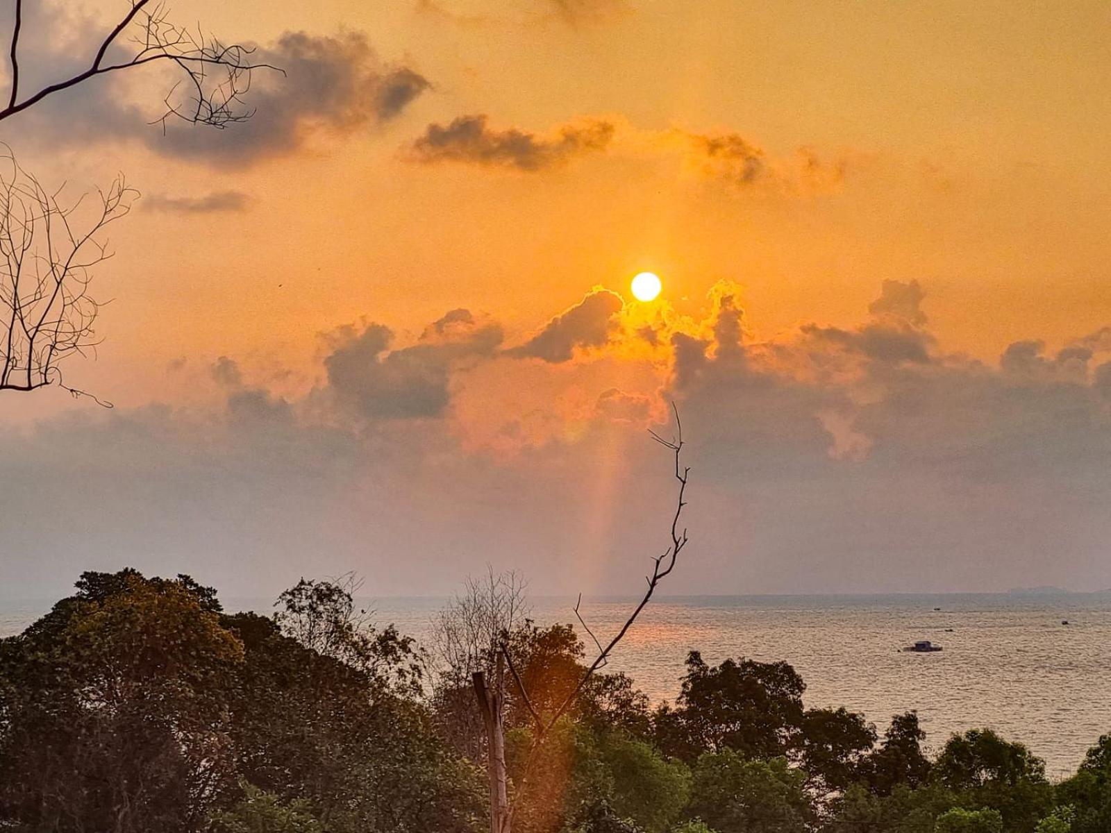 Amazing sunrise over wooden house at the East
