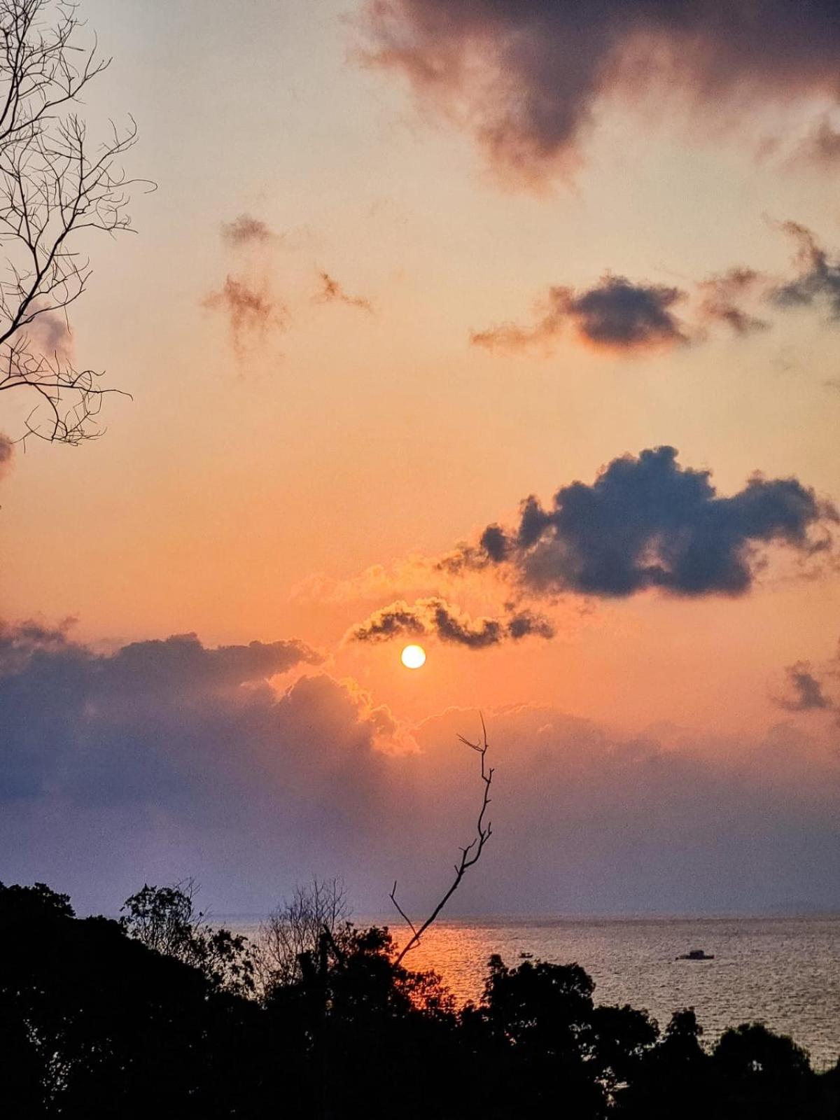 Amazing sunrise over wooden house at the East