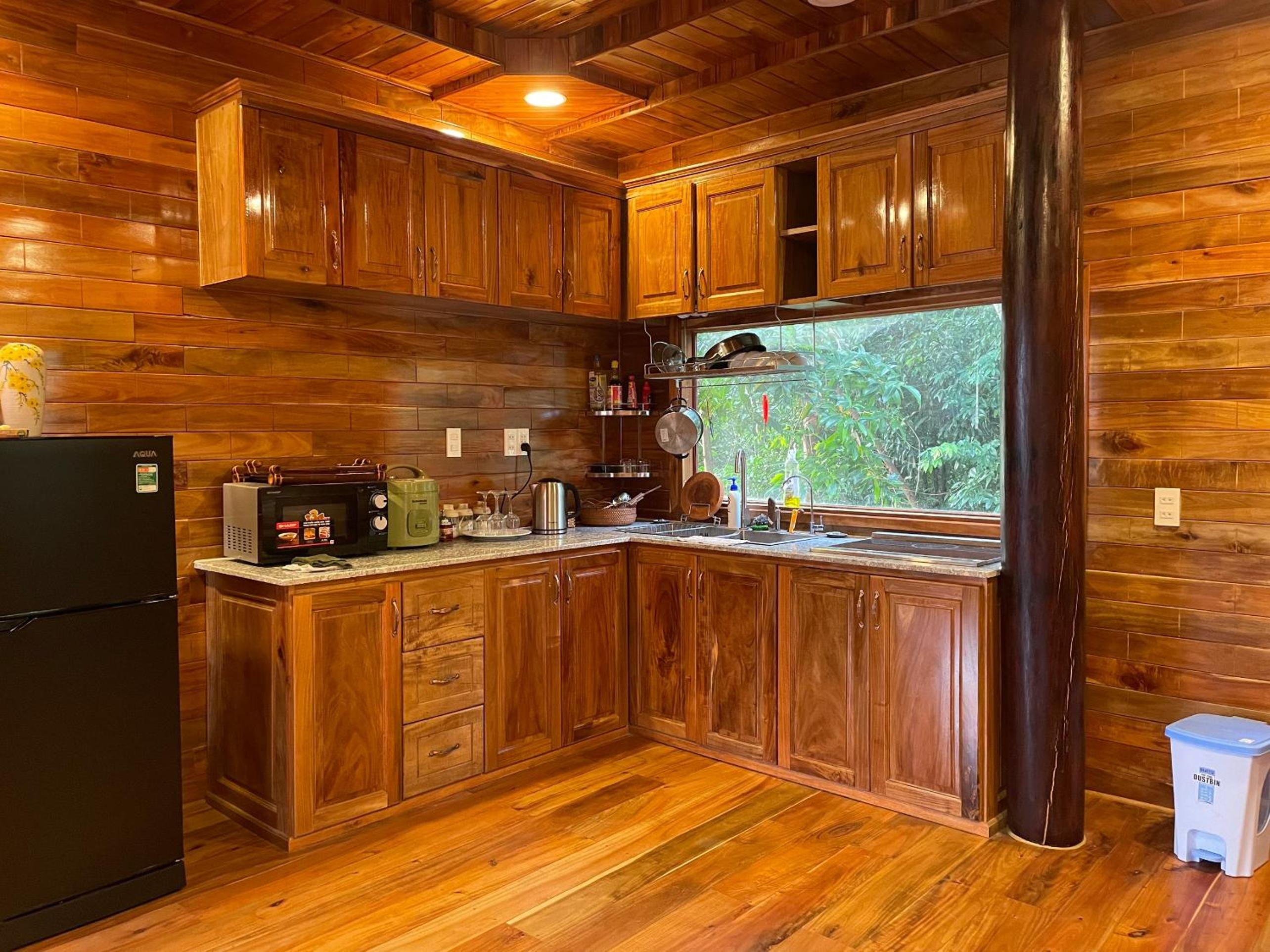 Amazing sunrise over wooden house at the East
