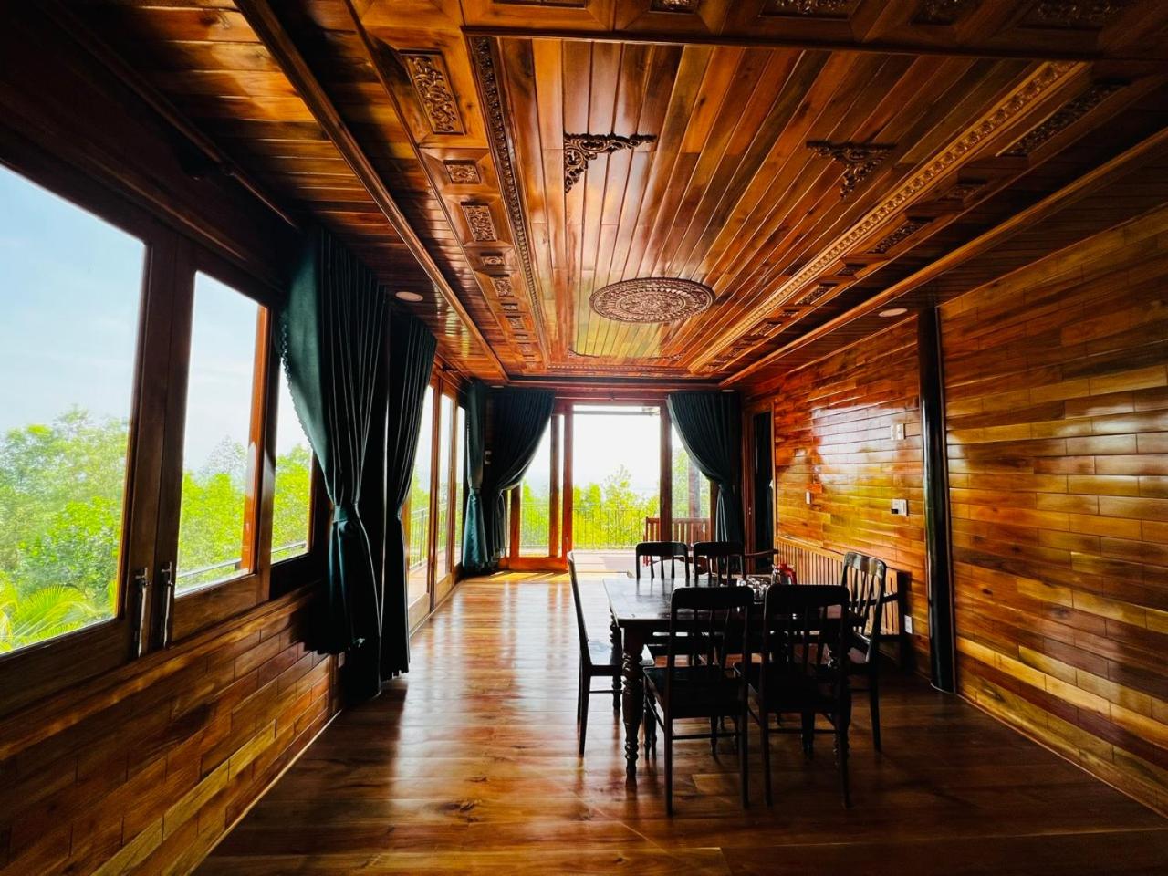 Amazing sunrise over wooden house at the East