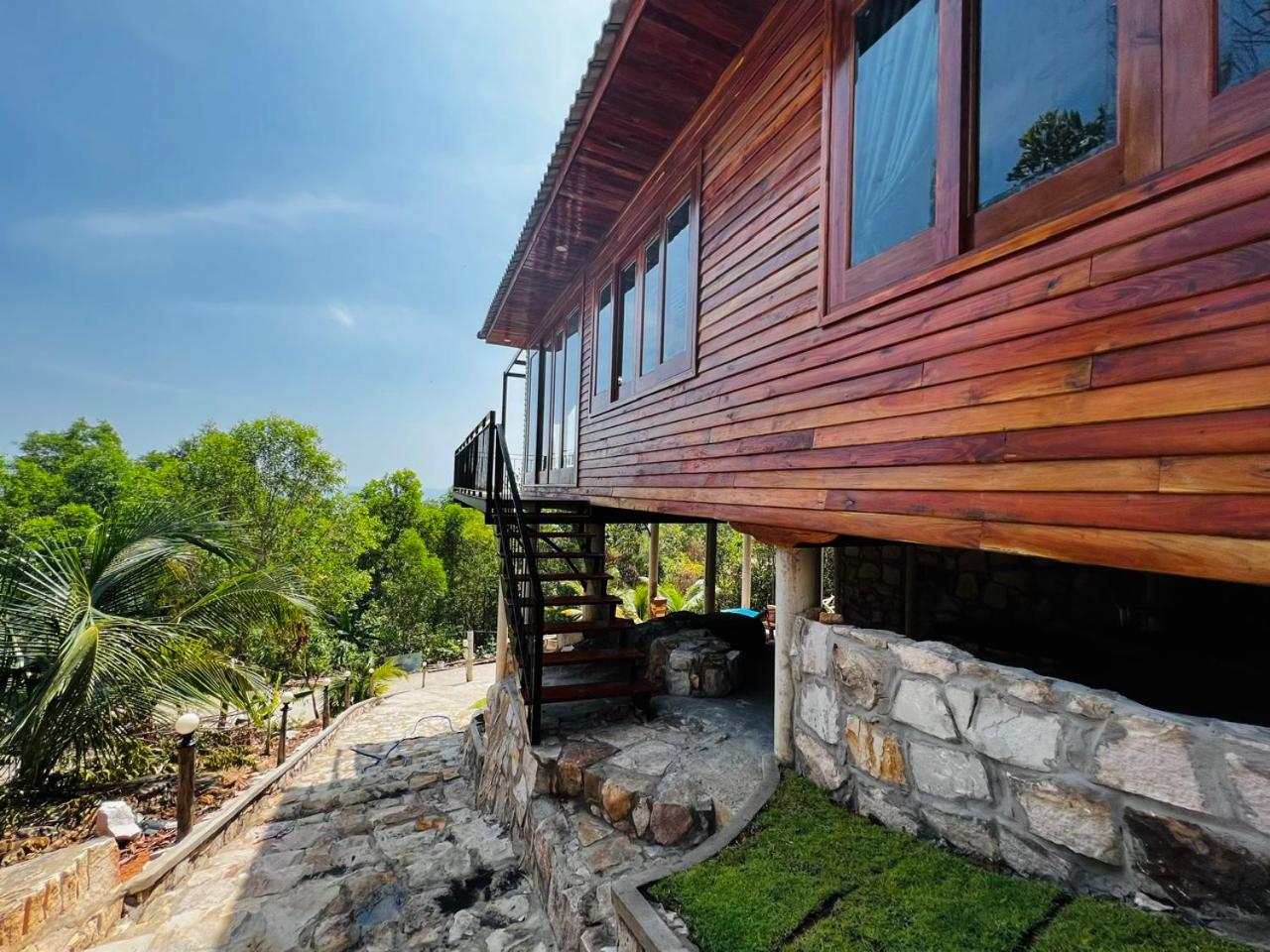 Amazing sunrise over wooden house at the East