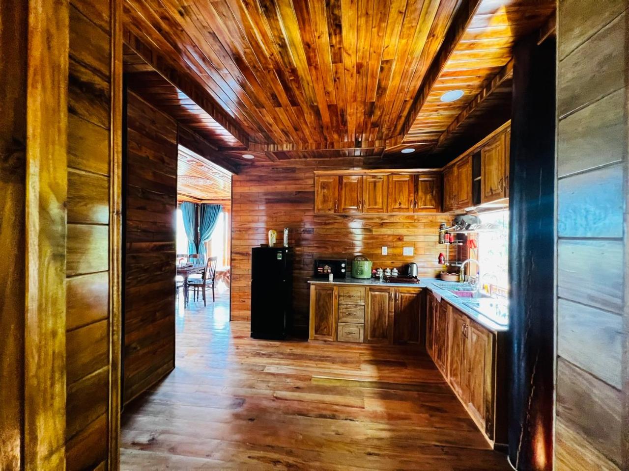 Amazing sunrise over wooden house at the East