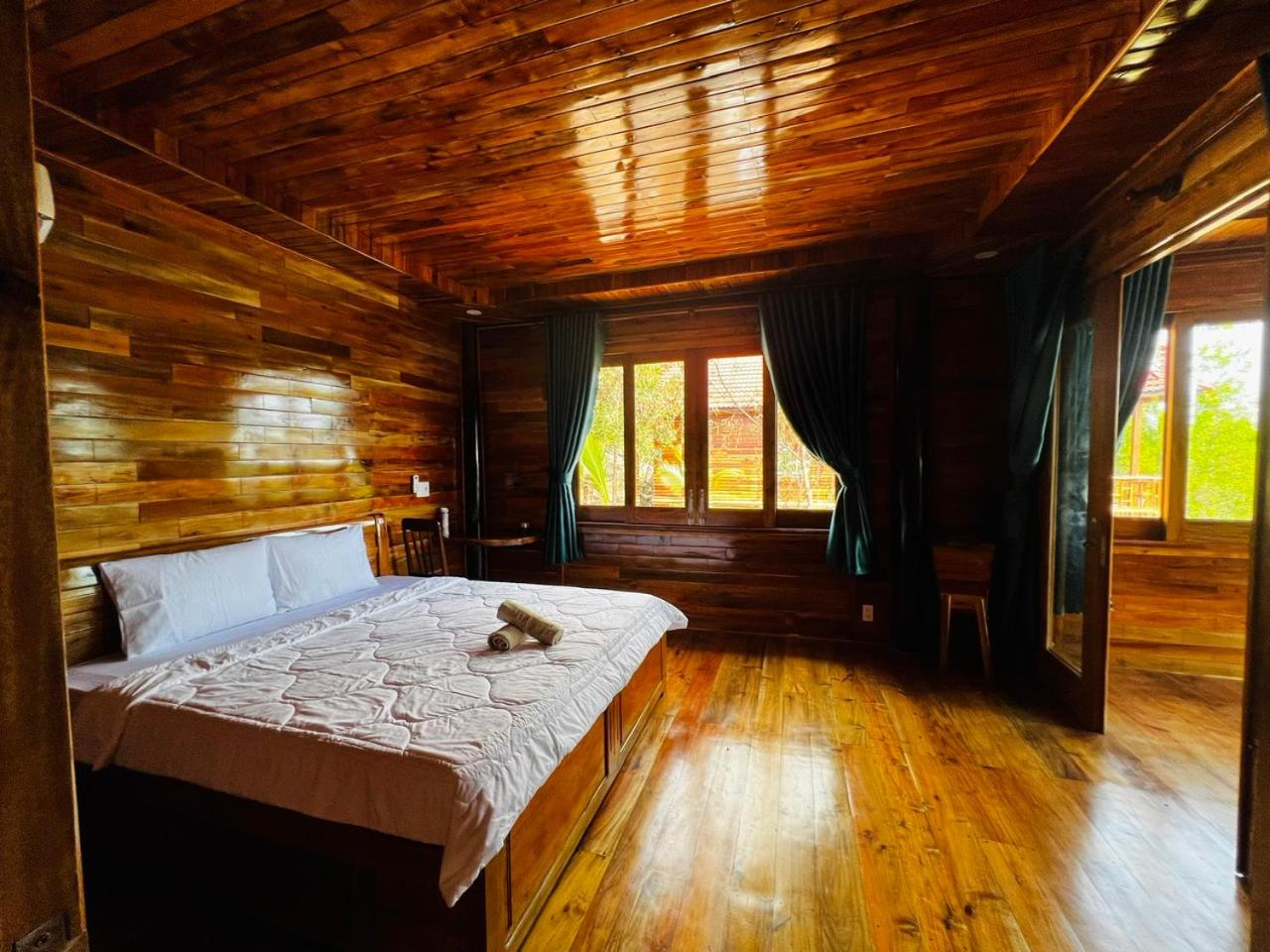 Amazing sunrise over wooden house at the East
