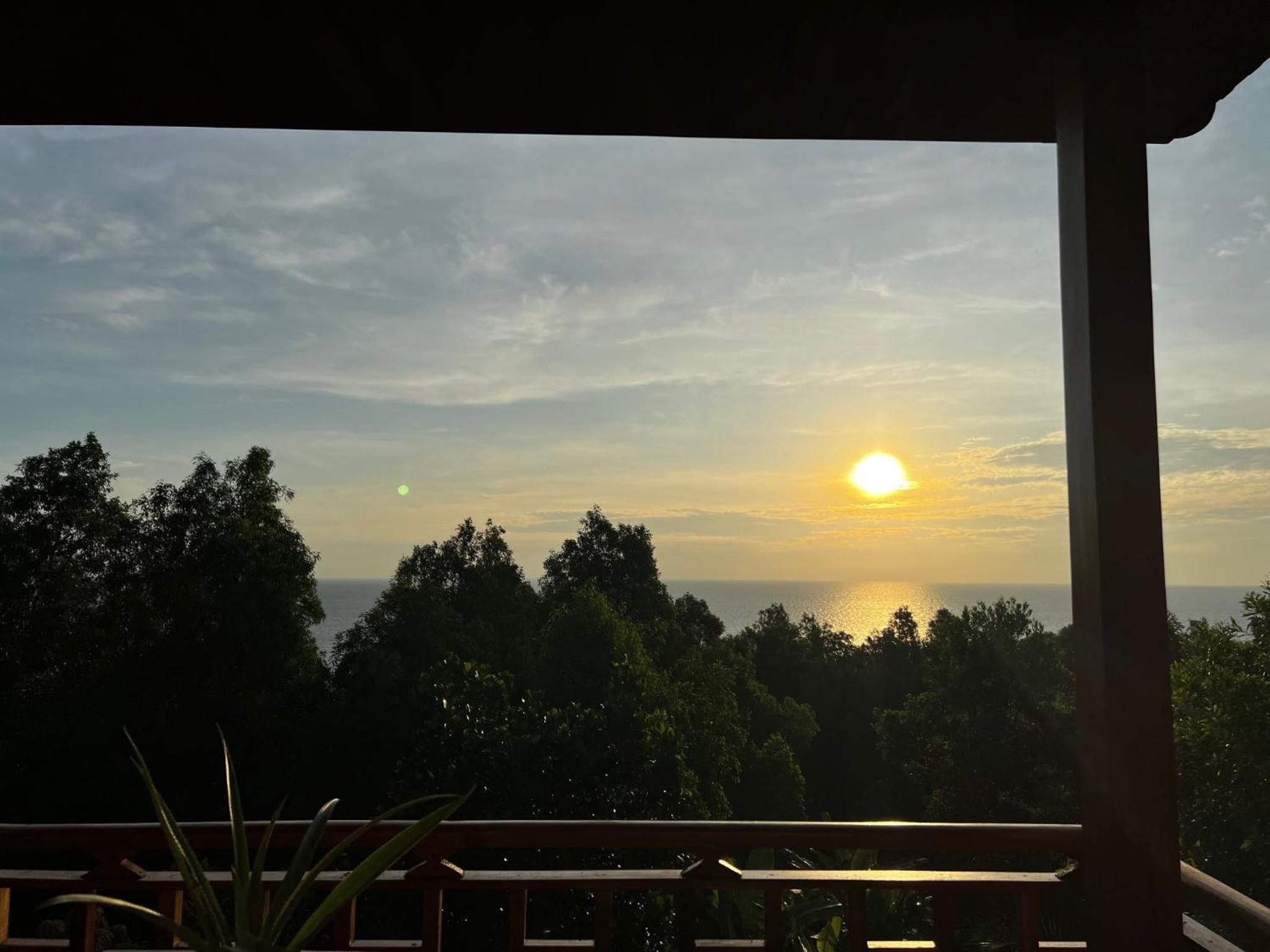 Amazing sunrise over wooden house at the East