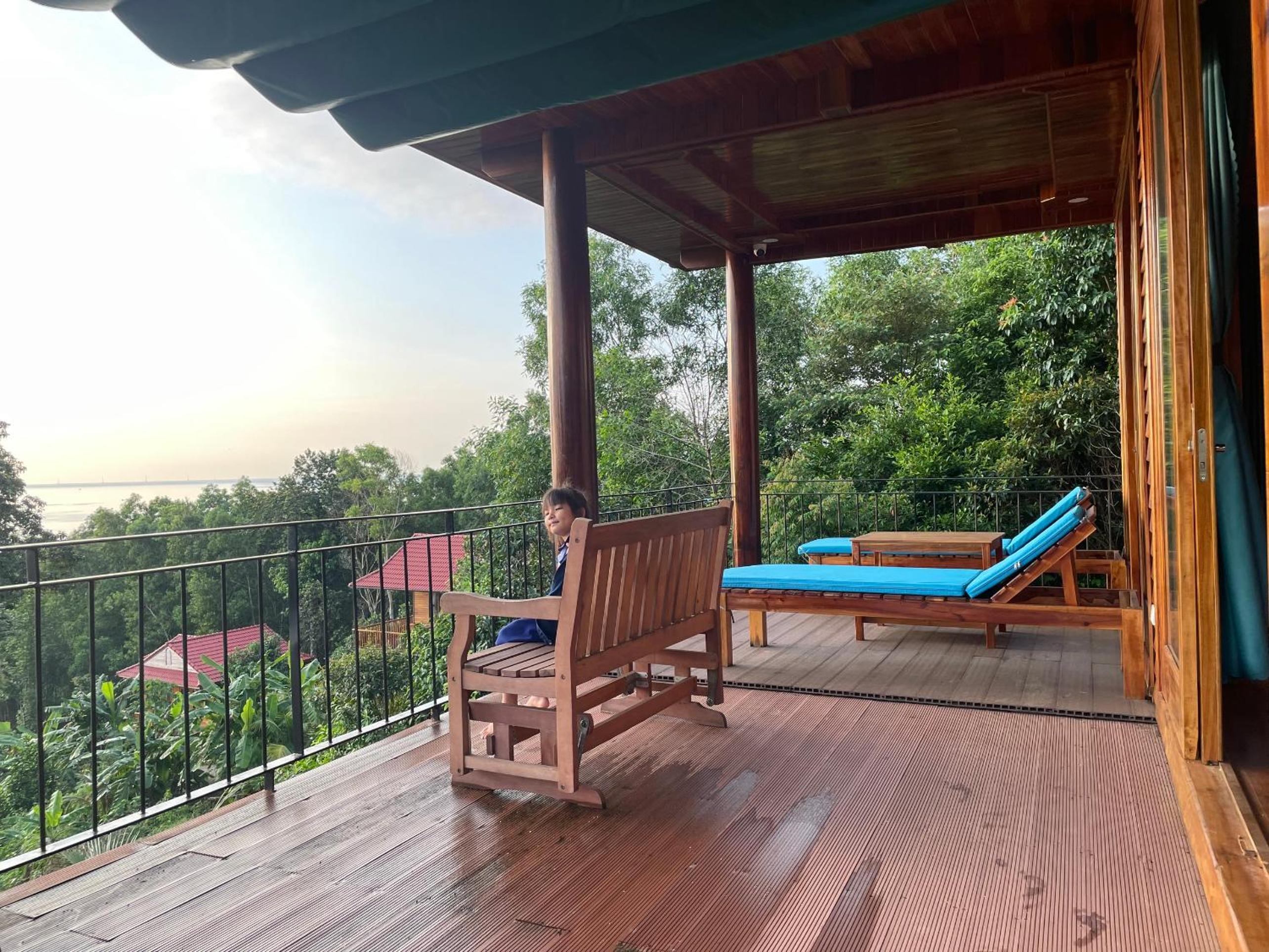 Amazing sunrise over wooden house at the East