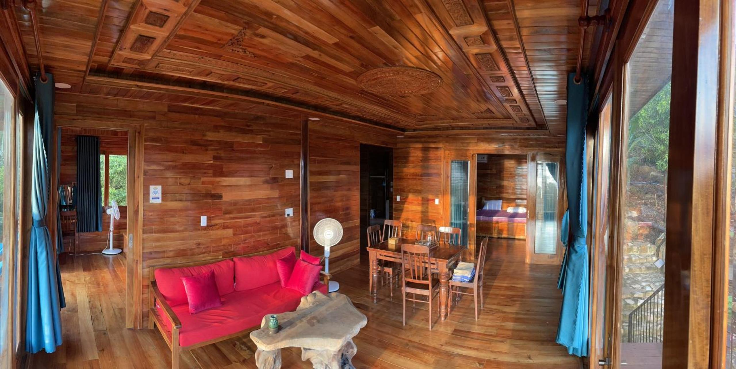 Amazing sunrise over wooden house at the East