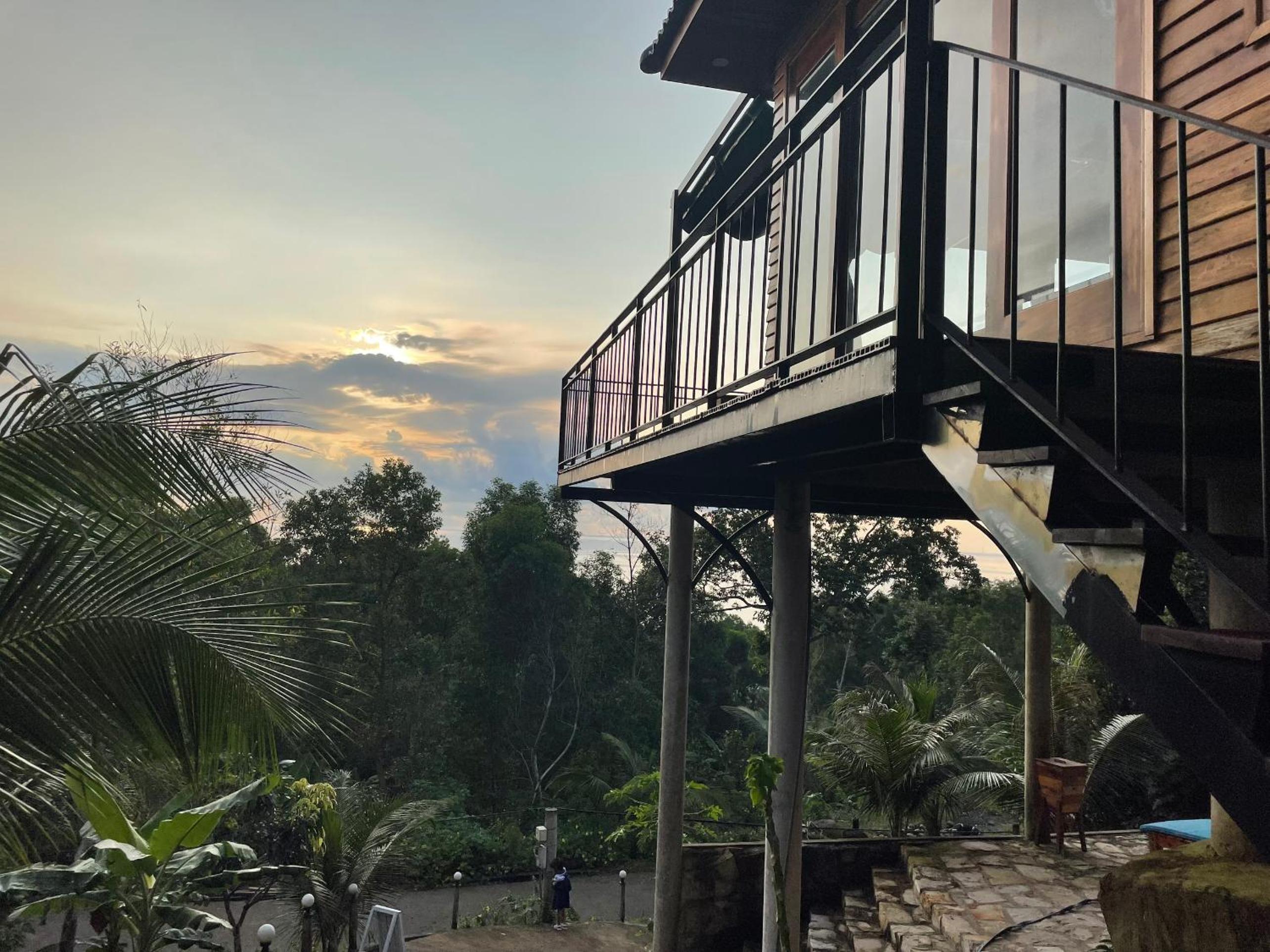 Amazing sunrise over wooden house at the East