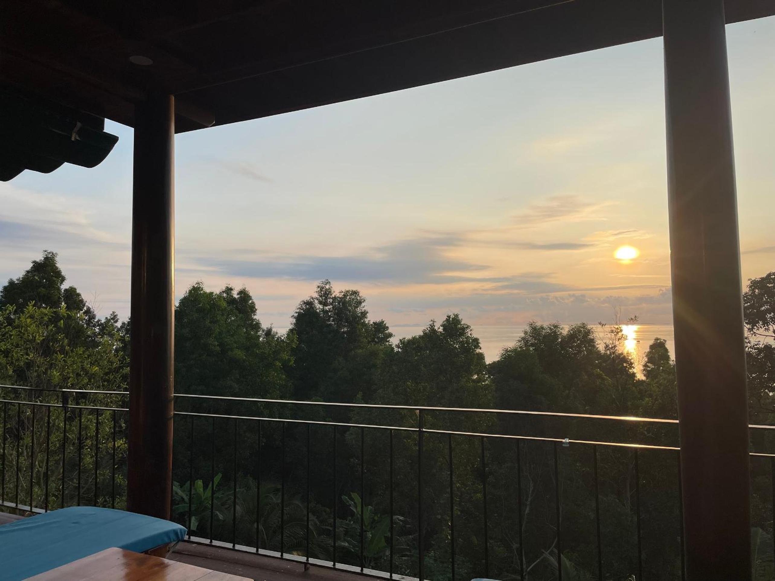 Amazing sunrise over wooden house at the East