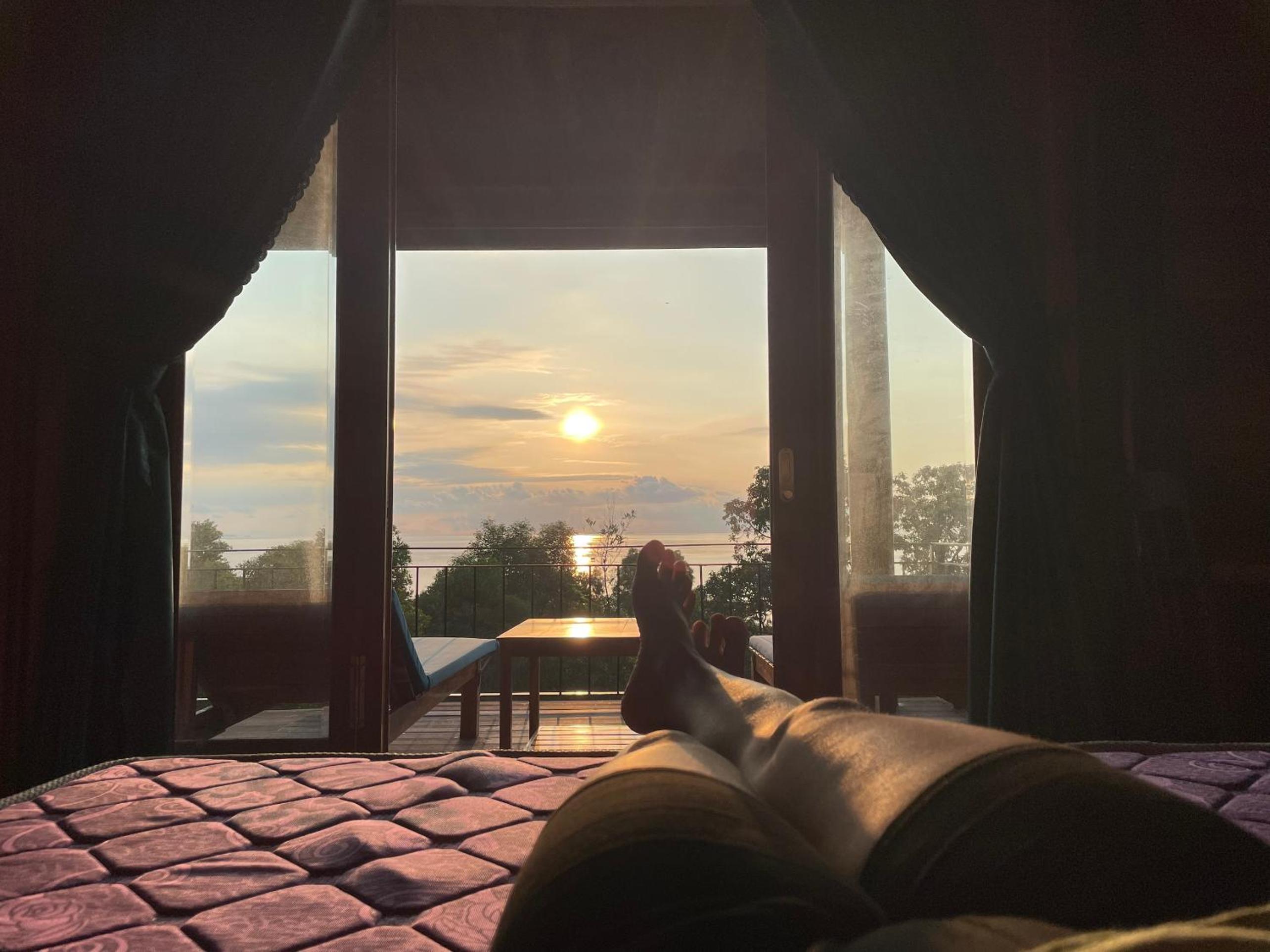 Amazing sunrise over wooden house at the East