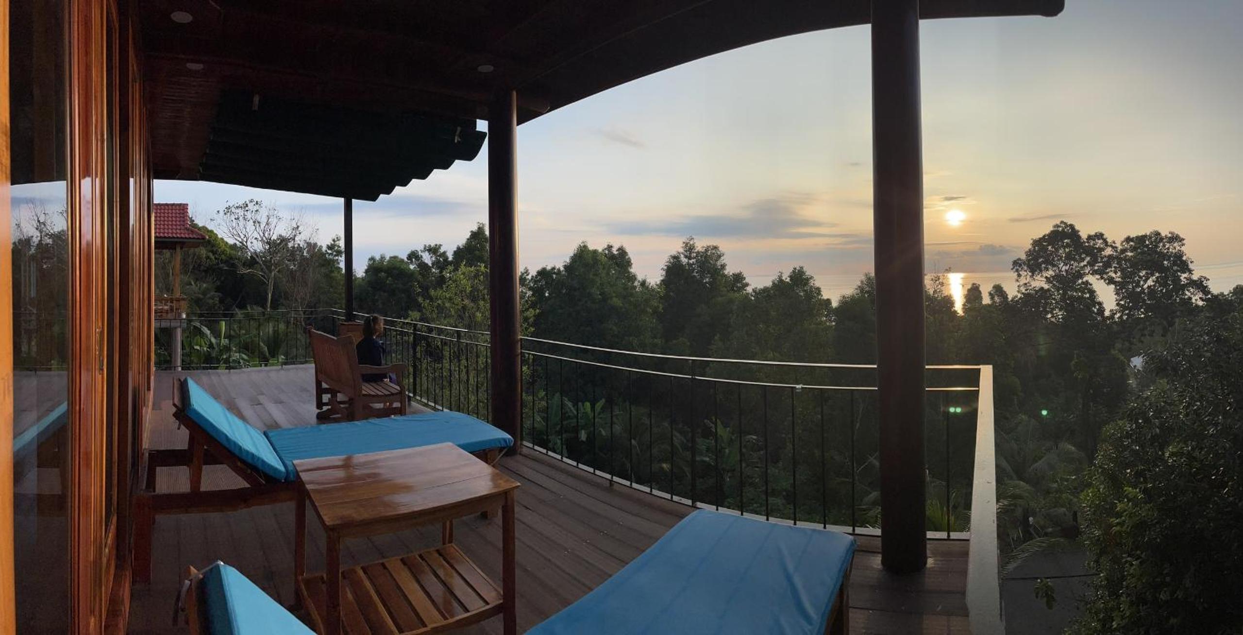 Amazing sunrise over wooden house at the East