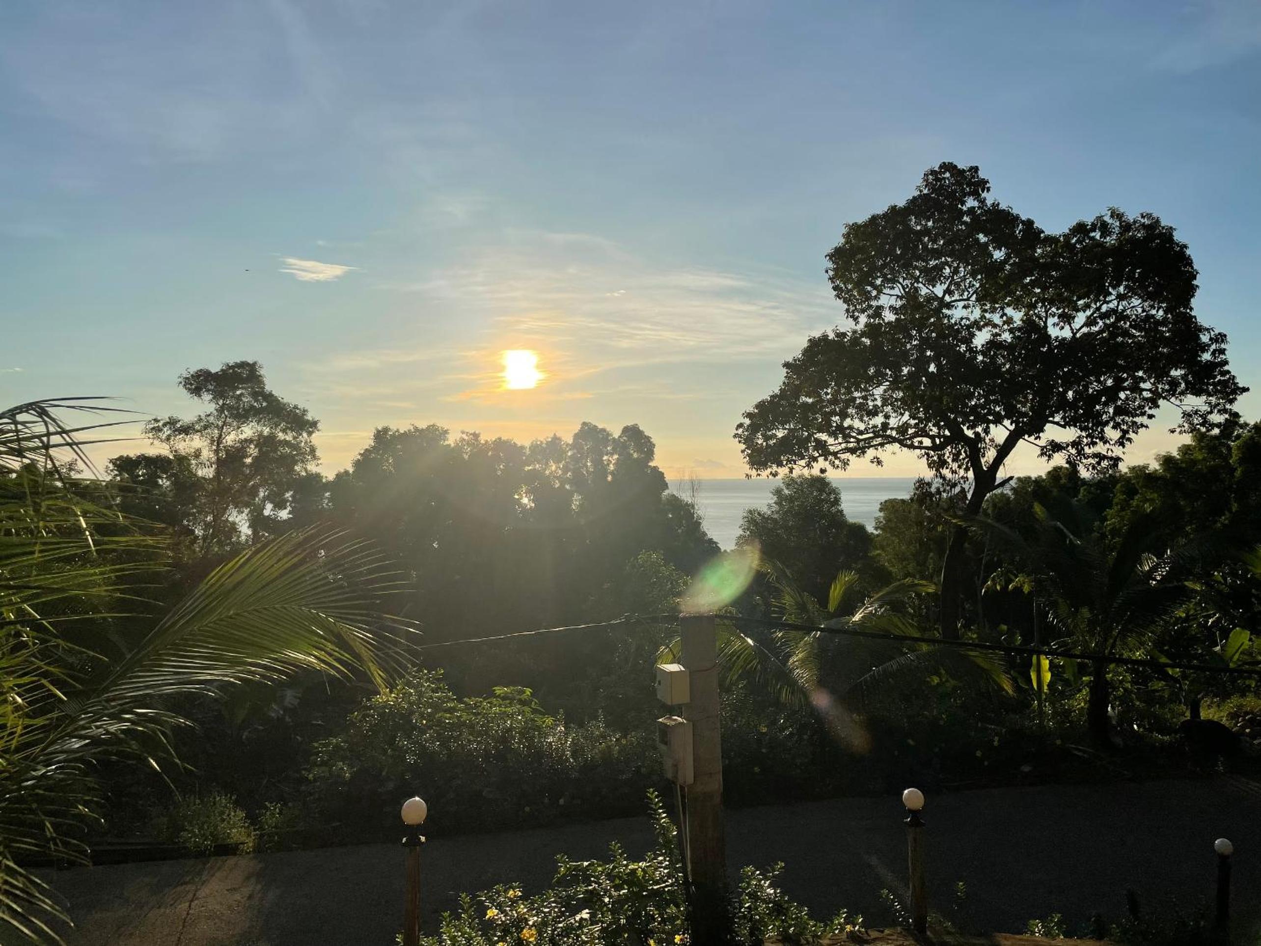 Amazing sunrise over wooden house at the East