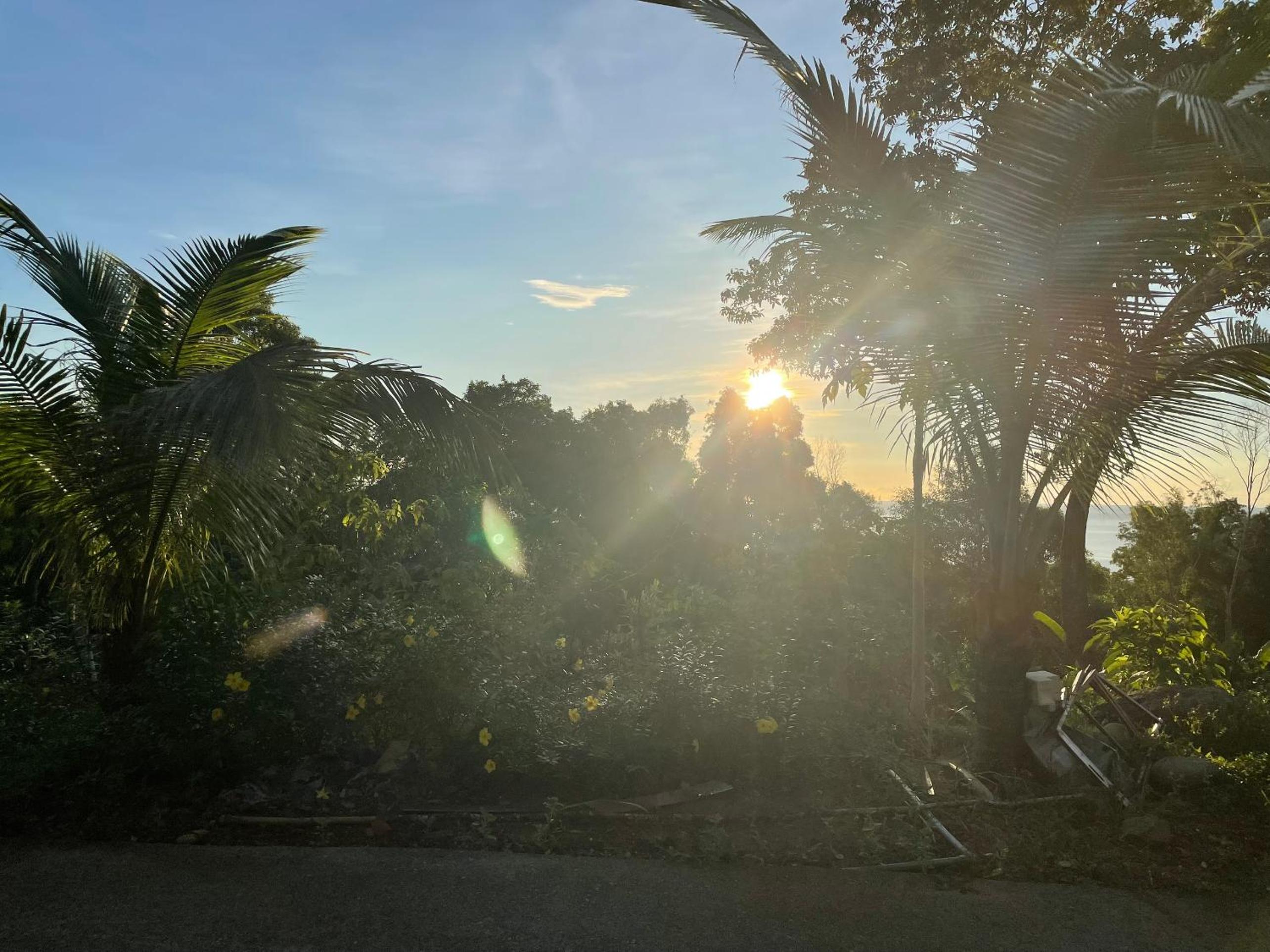 Amazing sunrise over wooden house at the East