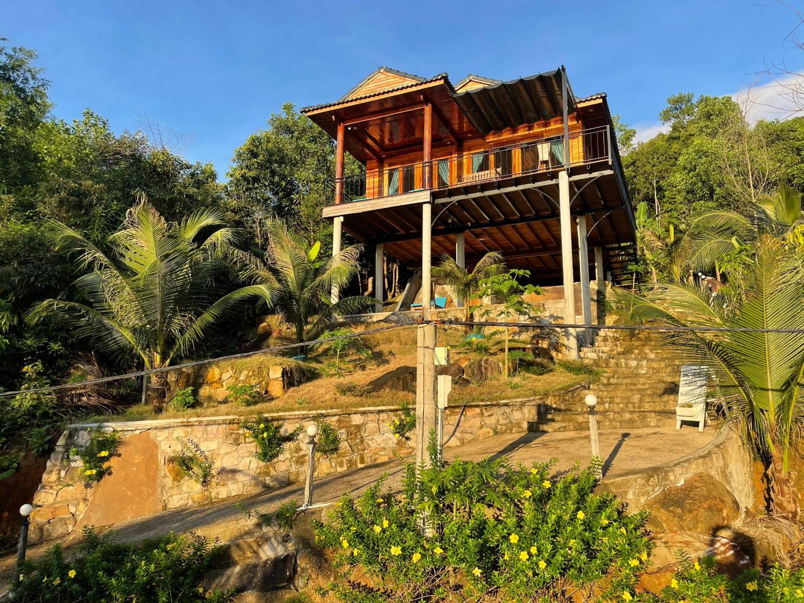 Amazing sunrise over wooden house at the East