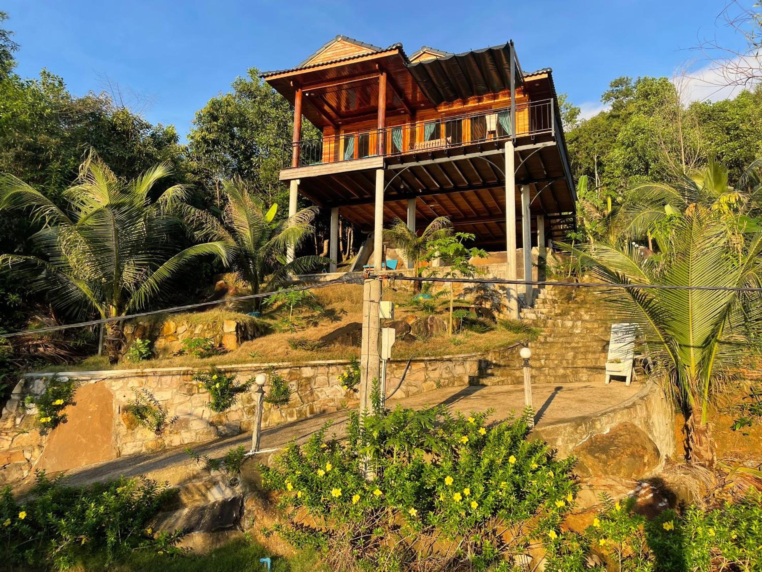 Amazing sunrise over wooden house at the East
