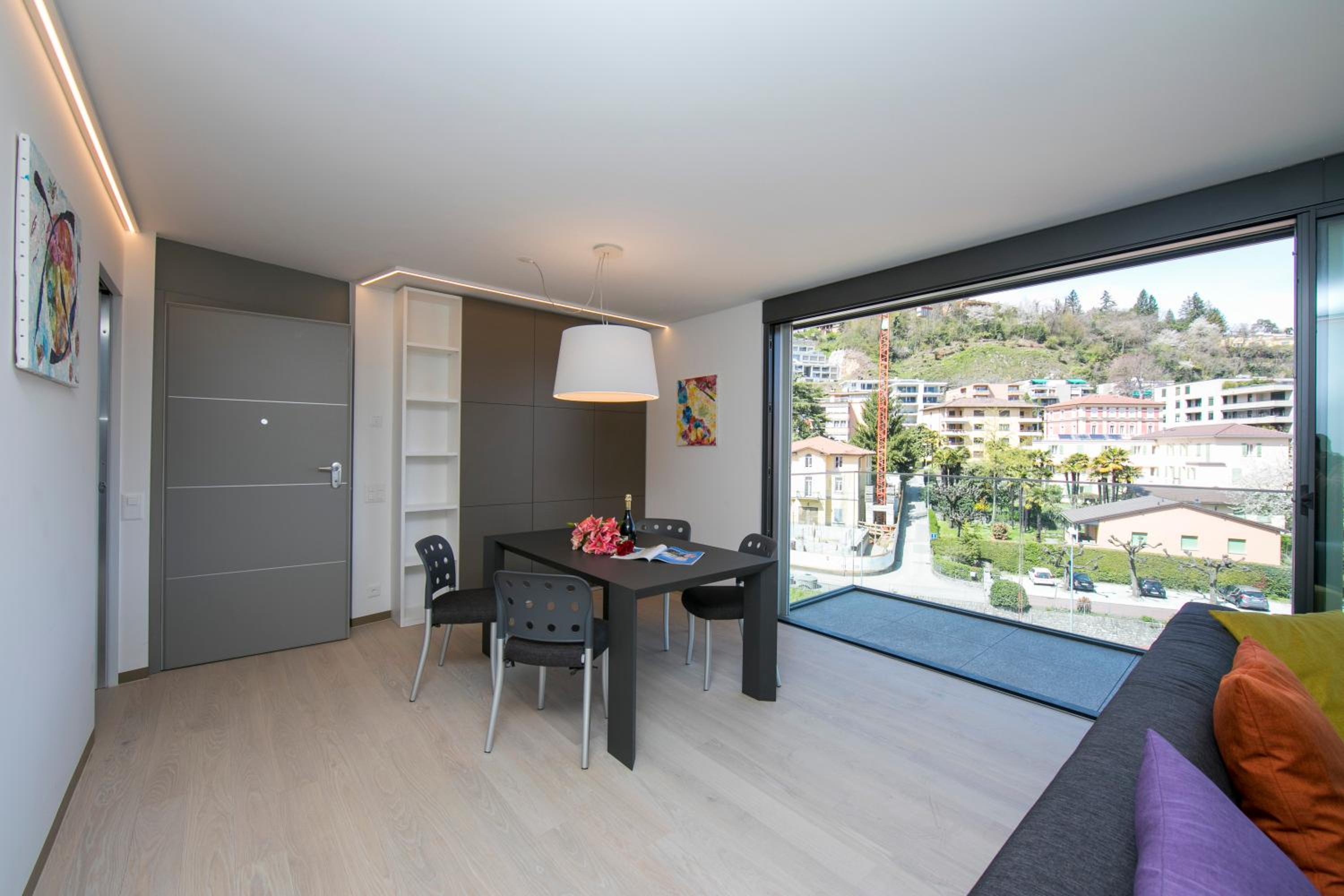 Urban Apartment Paradiso with Balcony and Parking - Happy Rentals