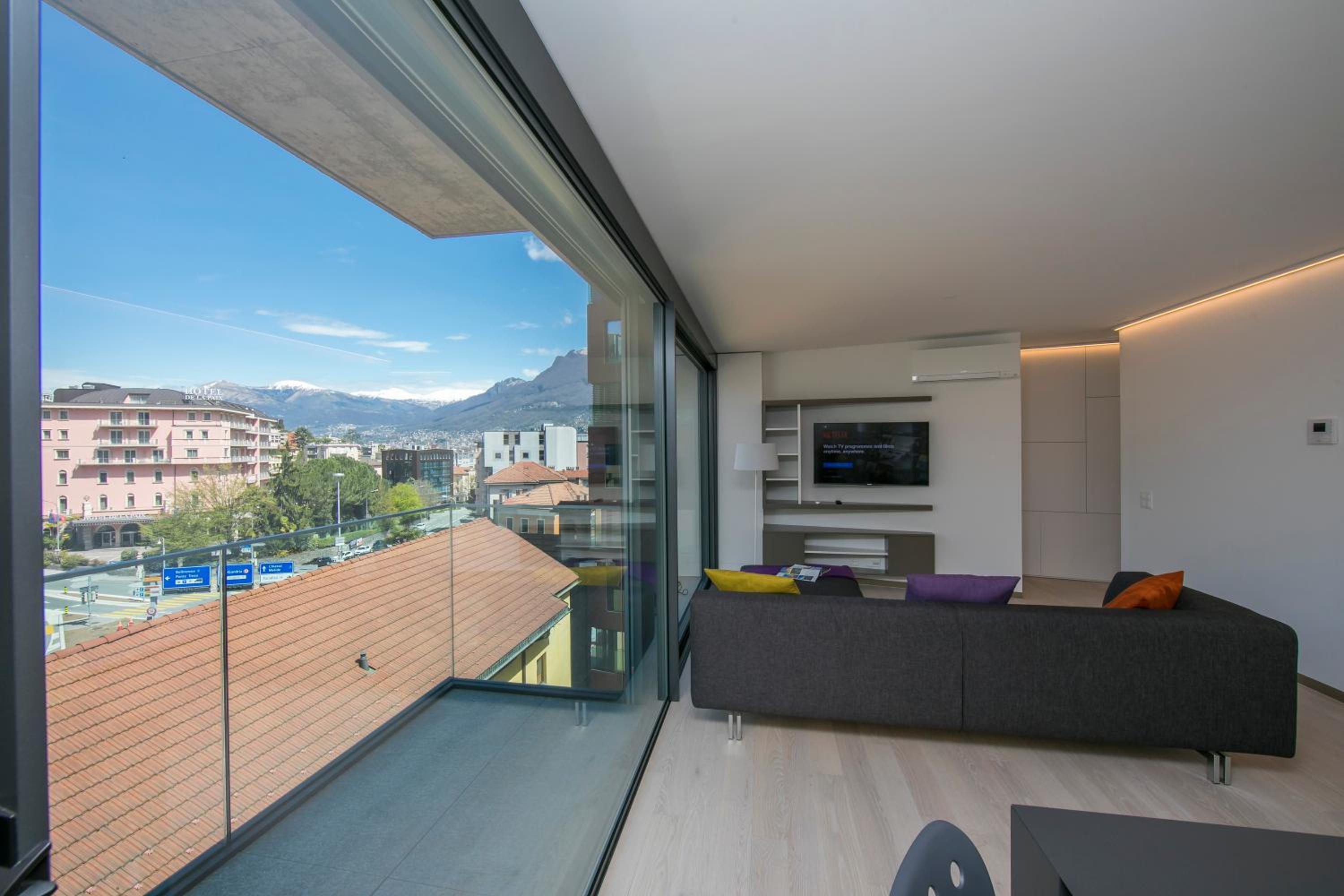 Urban Apartment Paradiso with Balcony and Parking - Happy Rentals