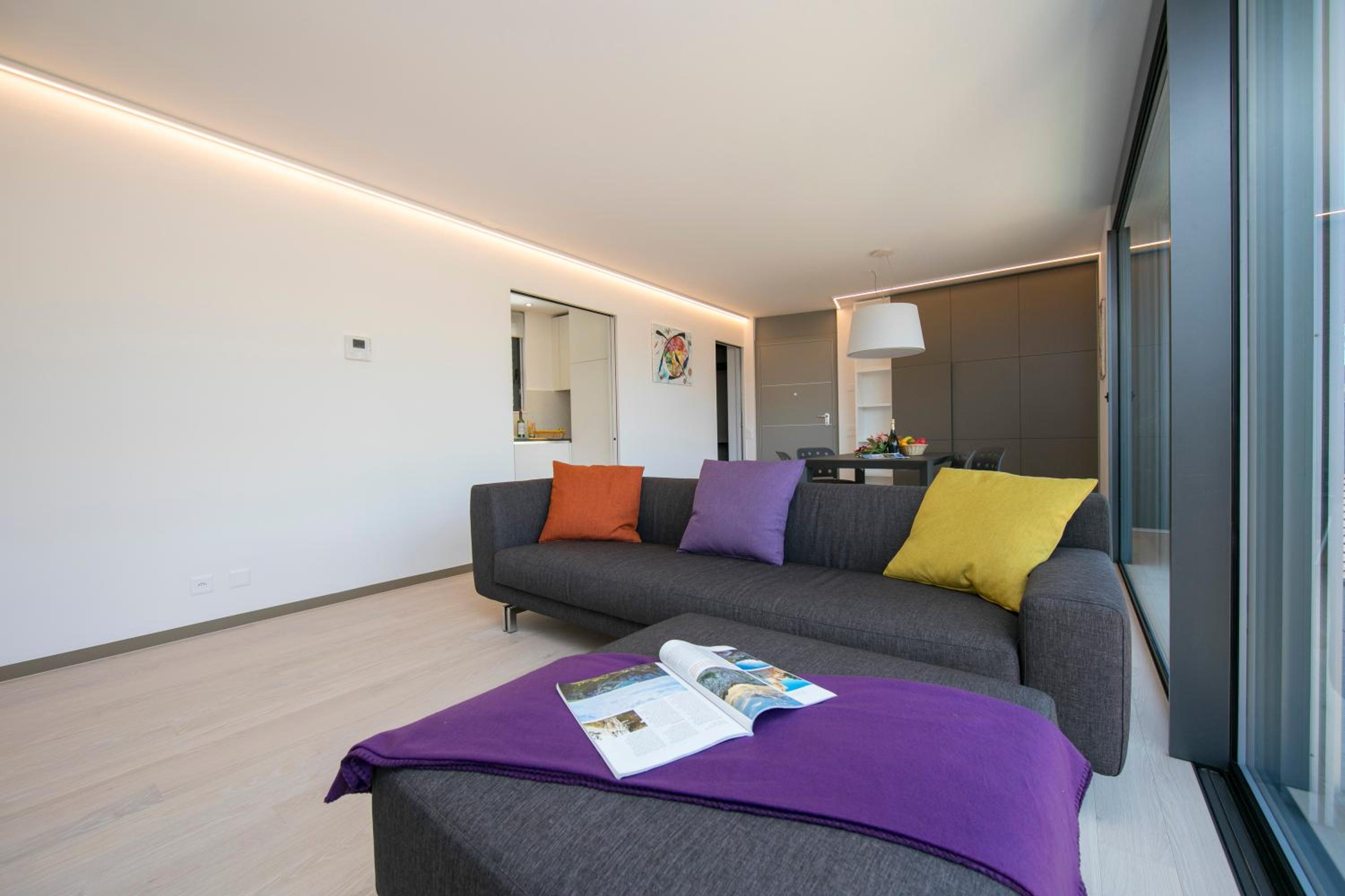 Urban Apartment Paradiso with Balcony and Parking - Happy Rentals