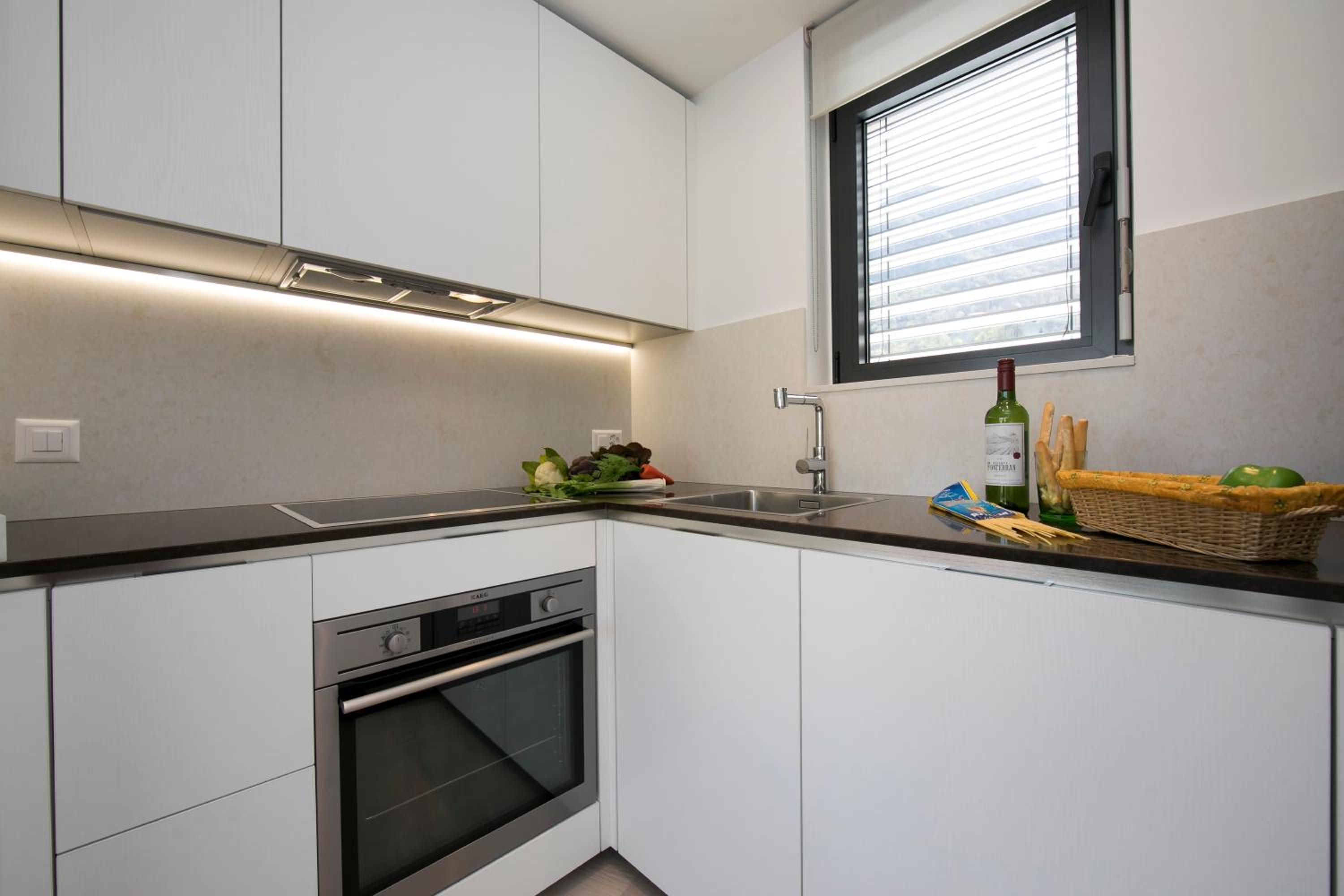 Urban Apartment Paradiso with Balcony and Parking - Happy Rentals