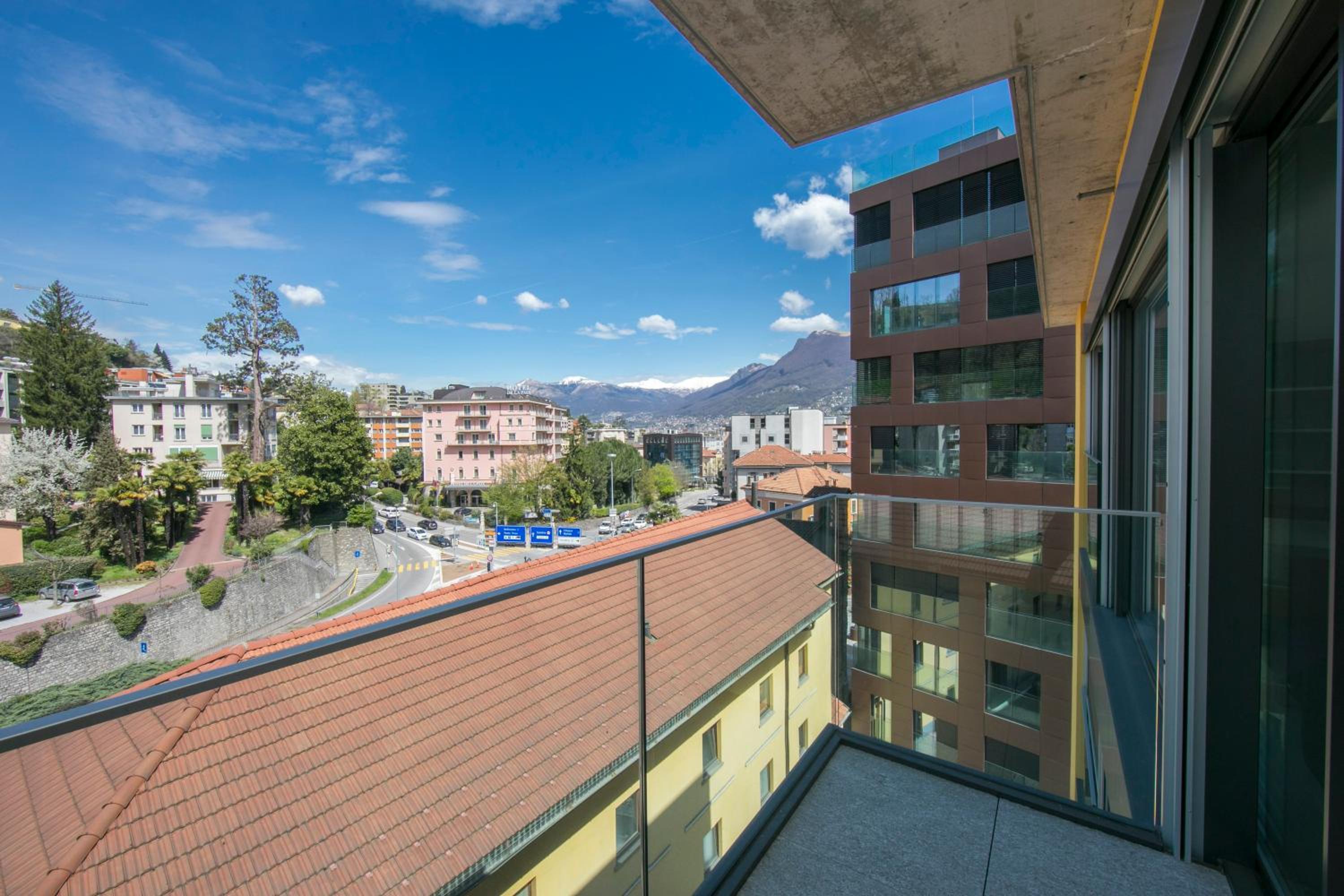 Urban Apartment Paradiso with Balcony and Parking - Happy Rentals