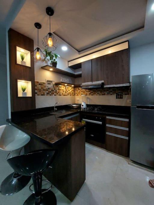 Apartamento en condominio con piscina