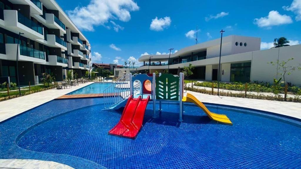 Resort em Porto de Galinhas- Flat Térreo Frente Piscinas- Muro Alto-B18