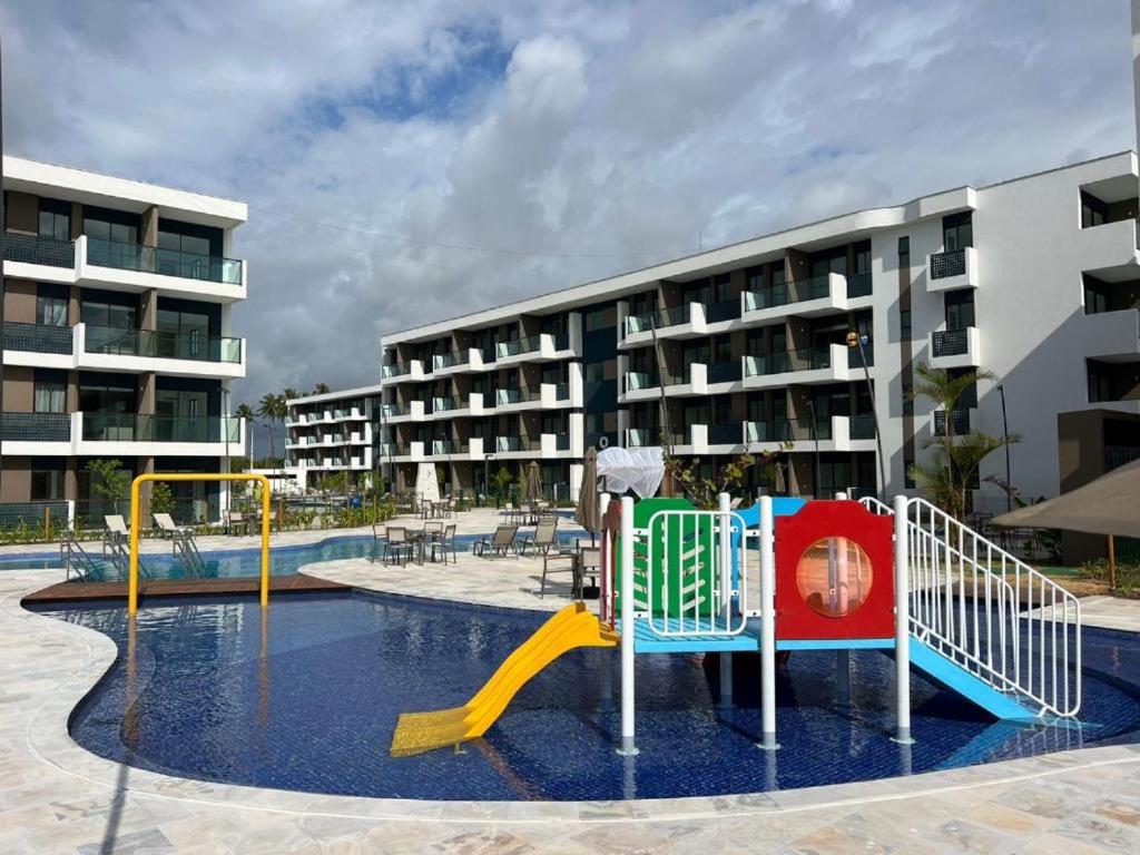 Resort em Porto de Galinhas- Flat Térreo Frente Piscinas- Muro Alto-B18