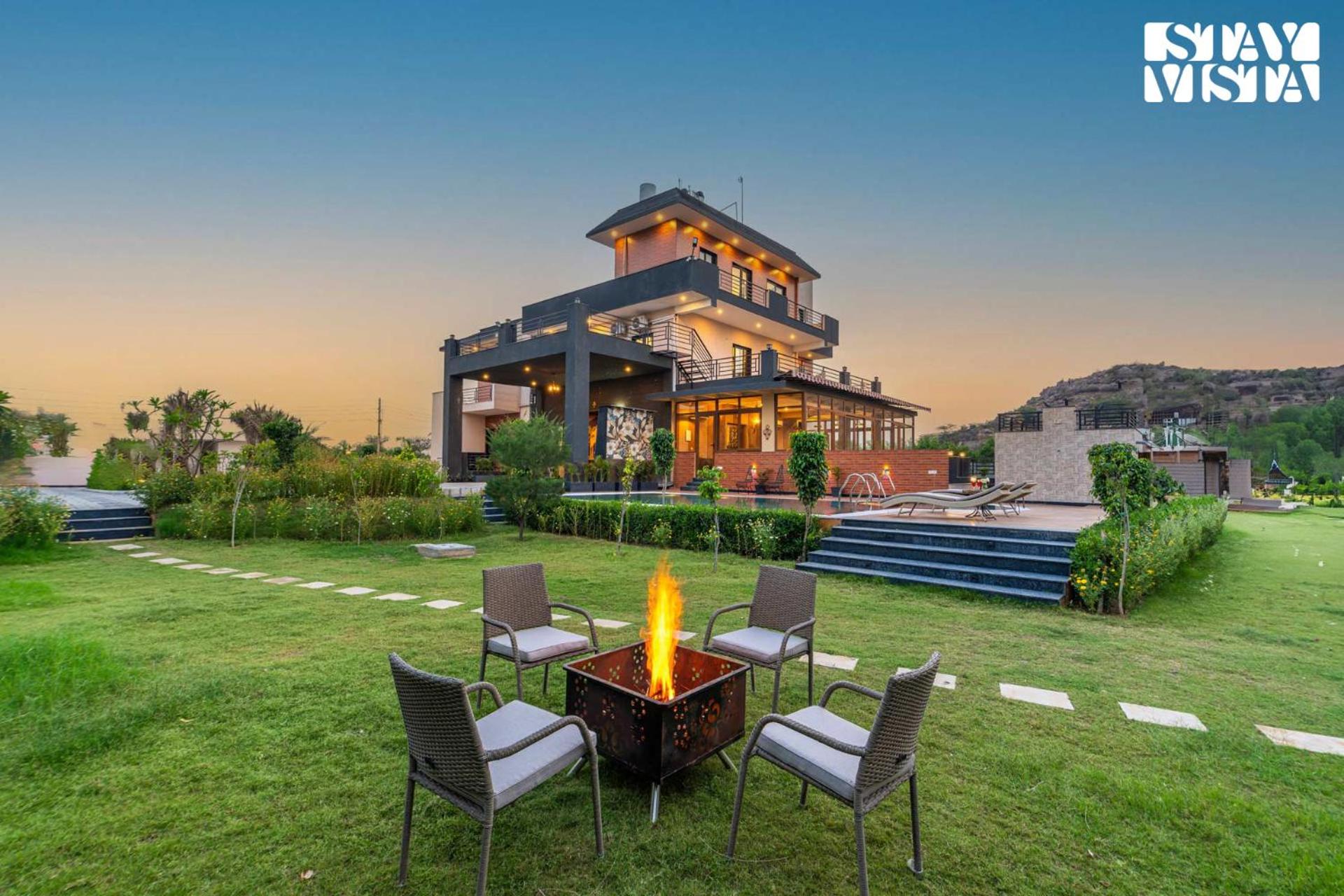 StayVista's Shivoham Farms - Mountain-View Villa with Outdoor Pool, Lawn, and Terrace