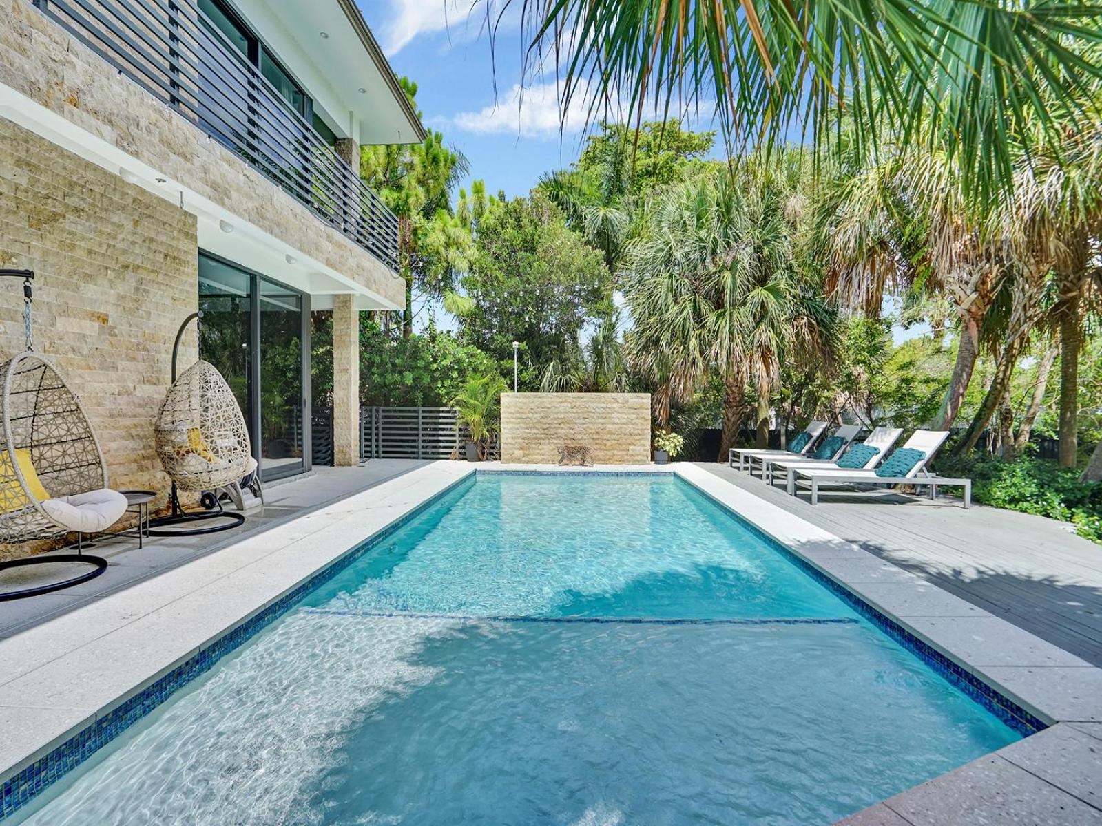 Experience Warmth & Comfort in our Stylish Balinese Waterfront Home