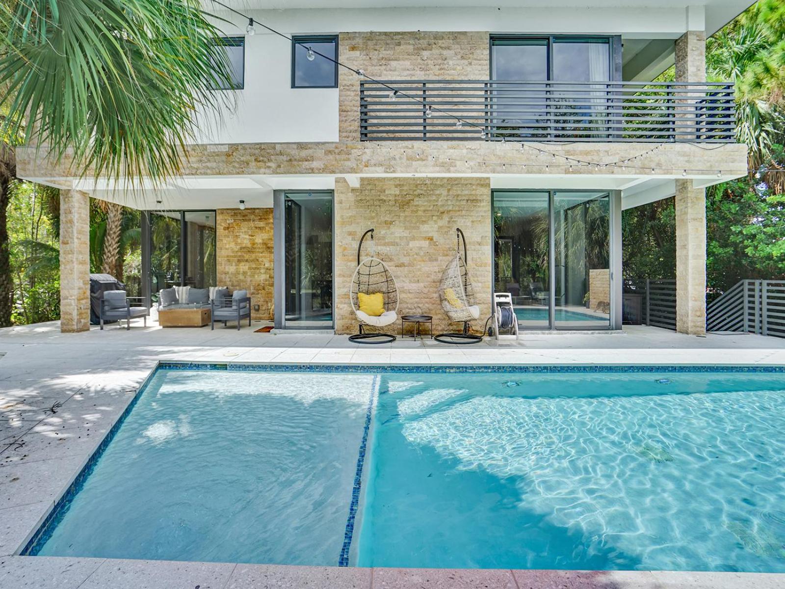 Experience Warmth & Comfort in our Stylish Balinese Waterfront Home