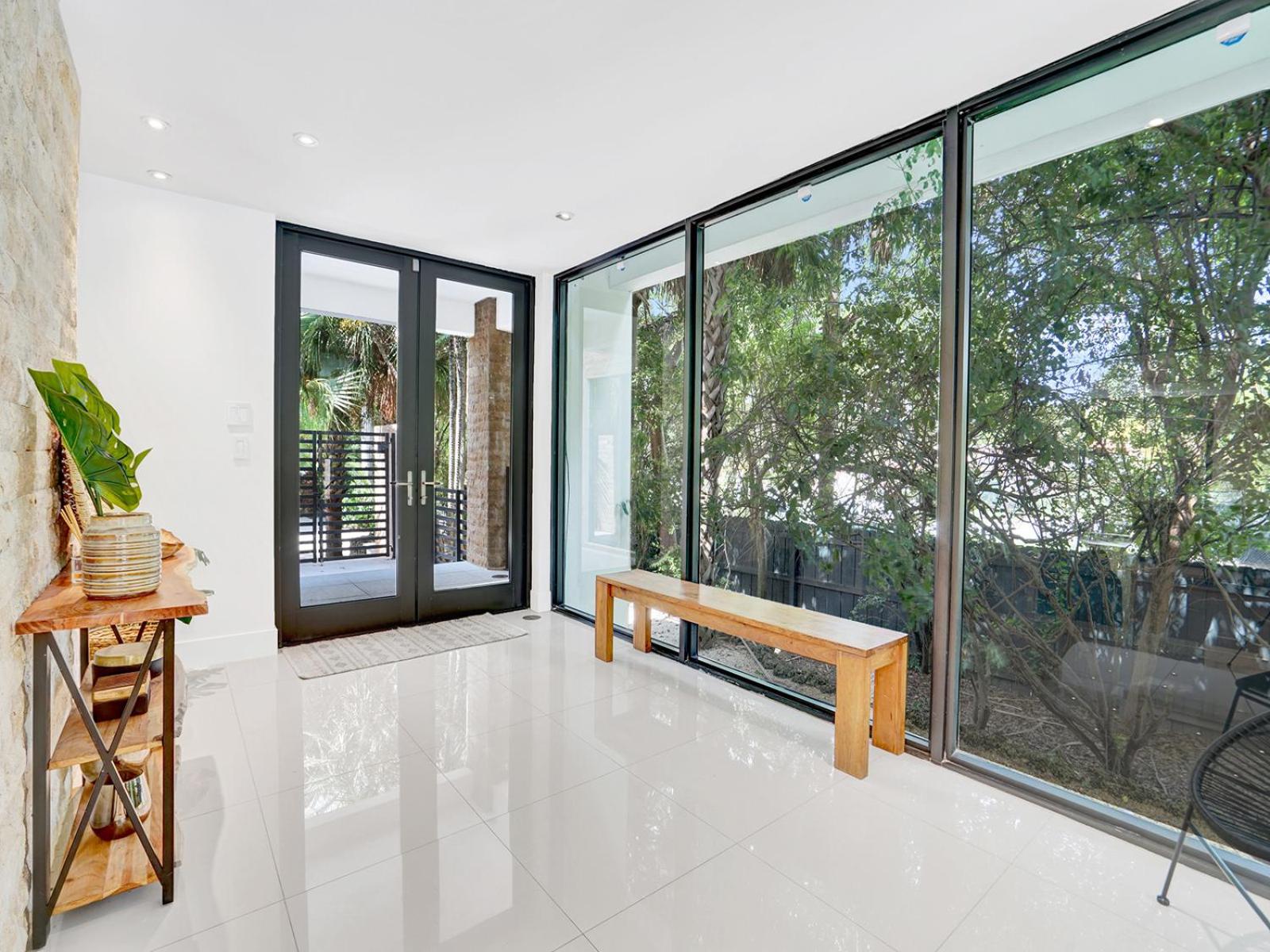 Experience Warmth & Comfort in our Stylish Balinese Waterfront Home
