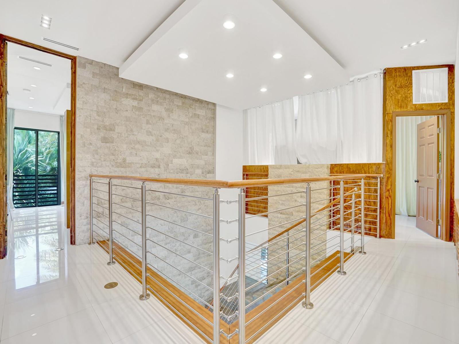 Experience Warmth & Comfort in our Stylish Balinese Waterfront Home
