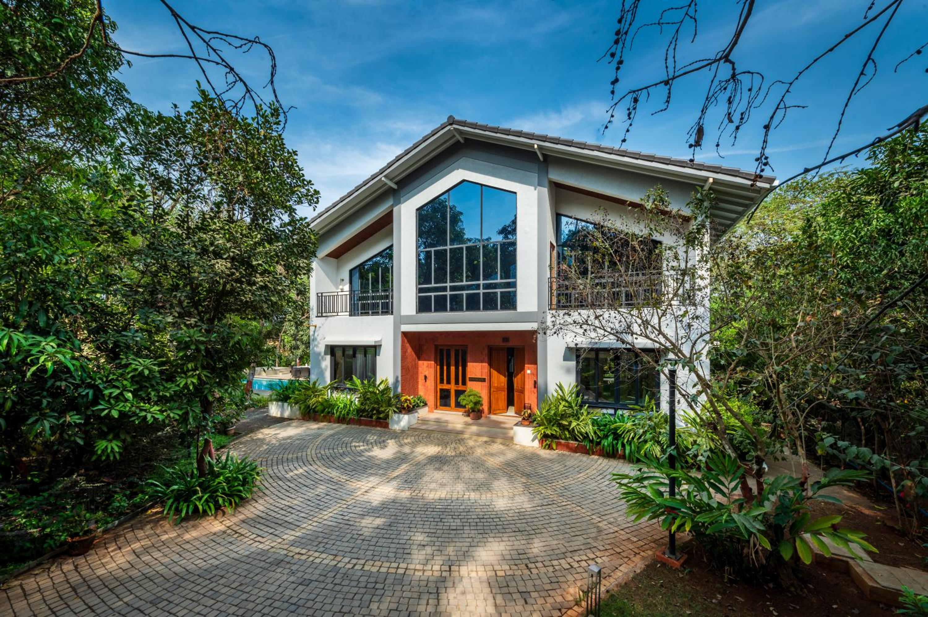 SaffronStays Arabella - 4BR bohemian pool villa with sunken lounge, foosball, PS4 & mango orchard views in Alibaug