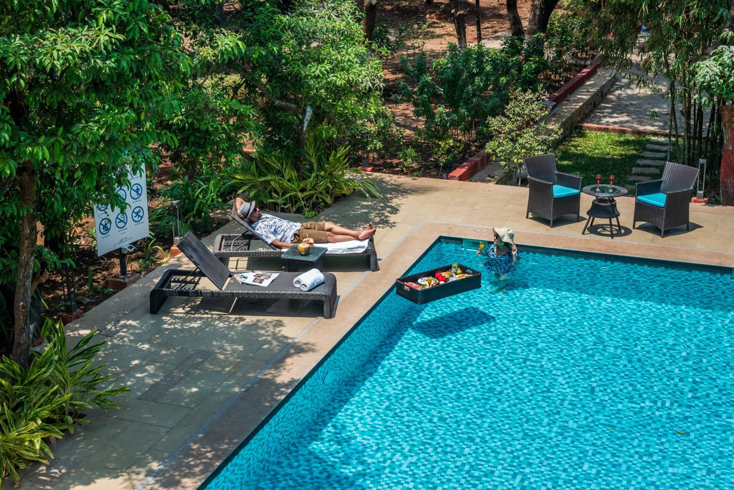 SaffronStays Arabella - 4BR bohemian pool villa with sunken lounge, foosball, PS4 & mango orchard views in Alibaug