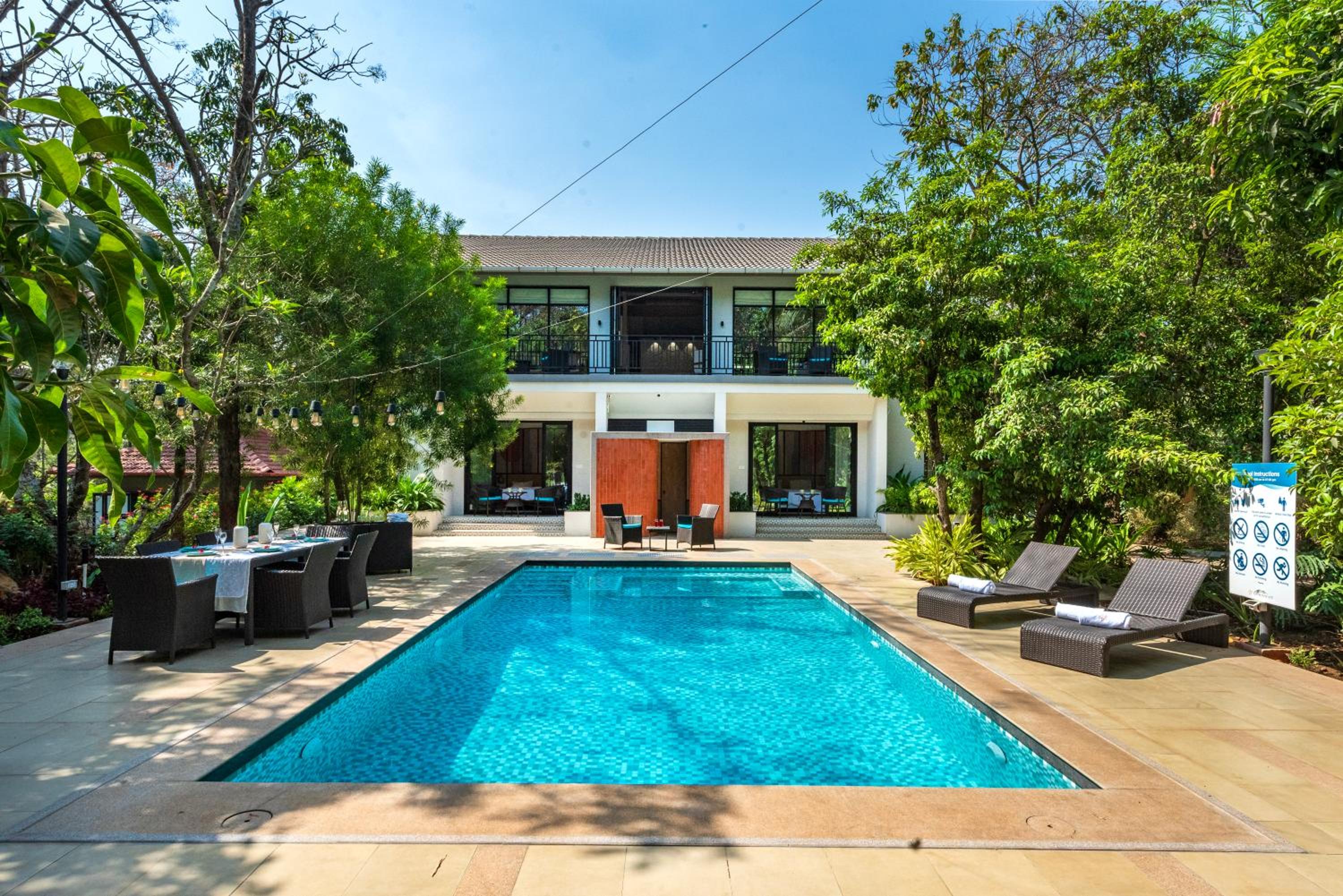 SaffronStays Arabella - 4BR bohemian pool villa with sunken lounge, foosball, PS4 & mango orchard views in Alibaug