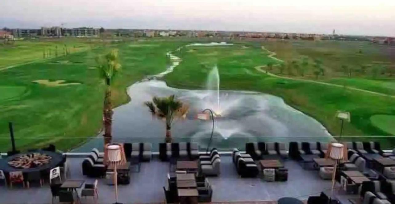 mini-villa situee dans une residence Prestigia à Marrakech, avec une vue sur la piscine et le golf une securite 24h sur 24 et une proximite ideale de l aer view 2