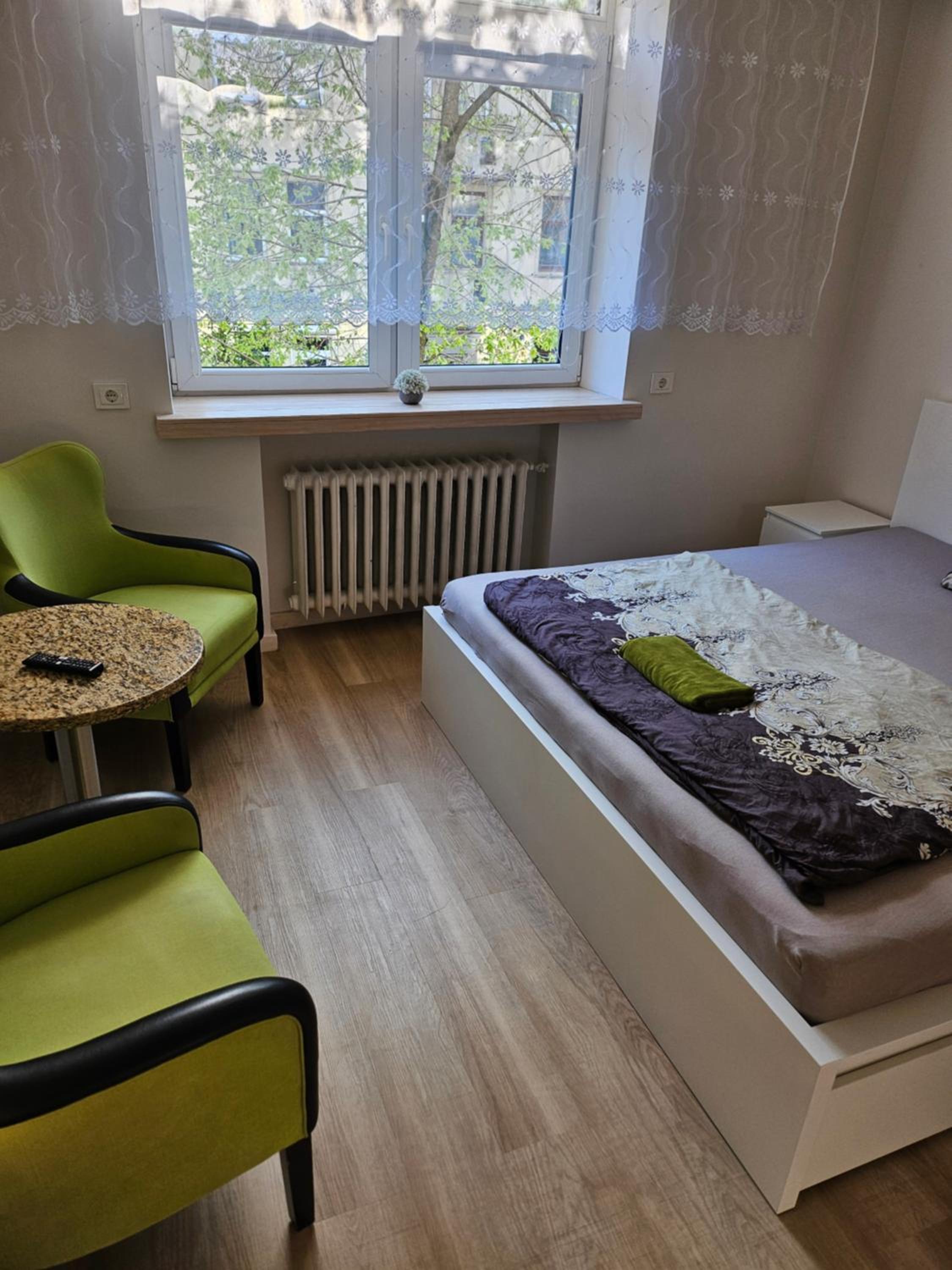 Kauno apartamentai king size bed view 3