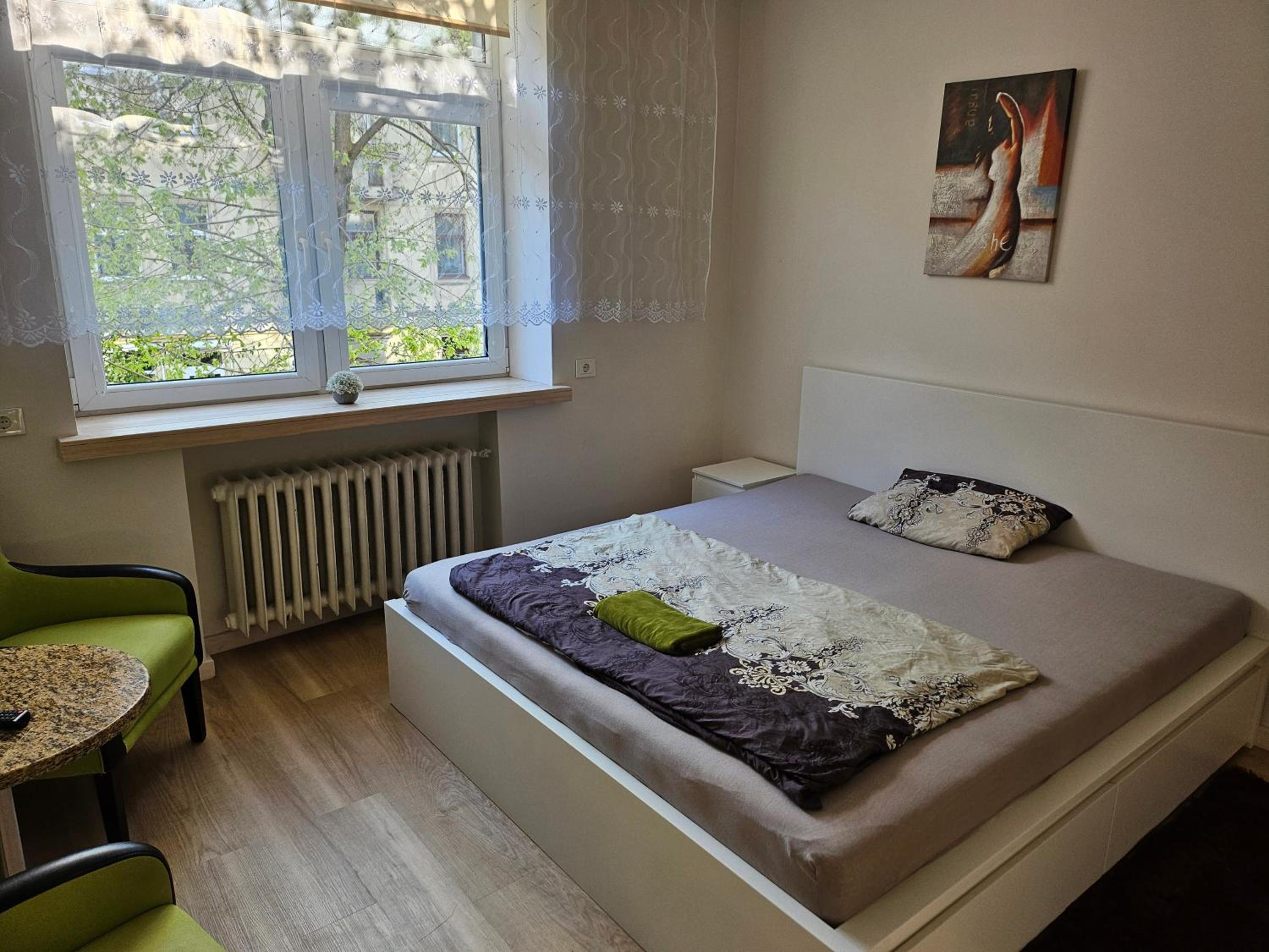 Kauno apartamentai king size bed view 2
