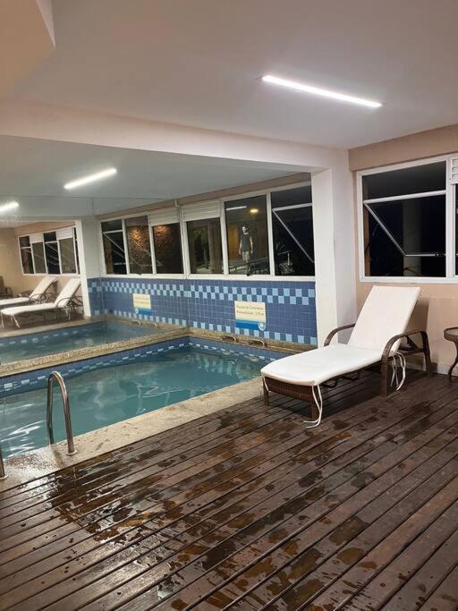 Flat em resort - pé na areia, Camboinhas